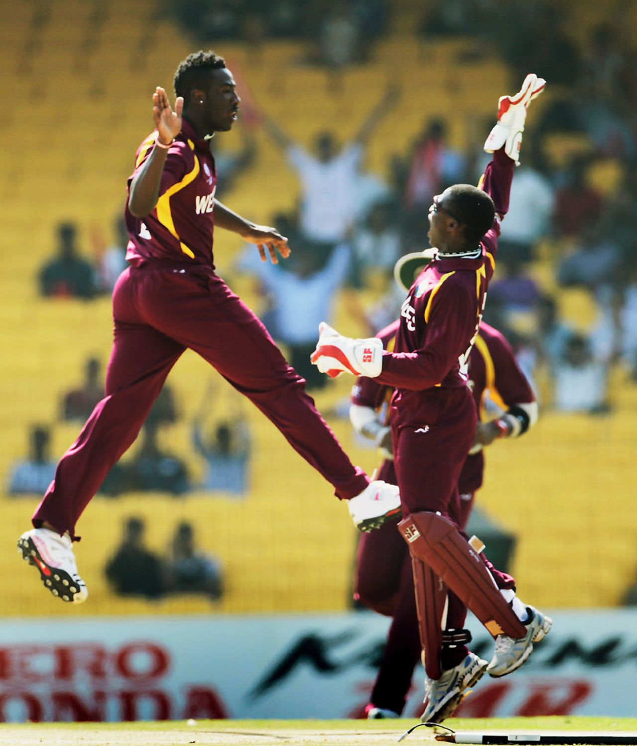 Andre Russell and Devon Thomas celebrate the dismissal of Matt Prior, England v West Indies, World Cup, Group B, March 17, 2011