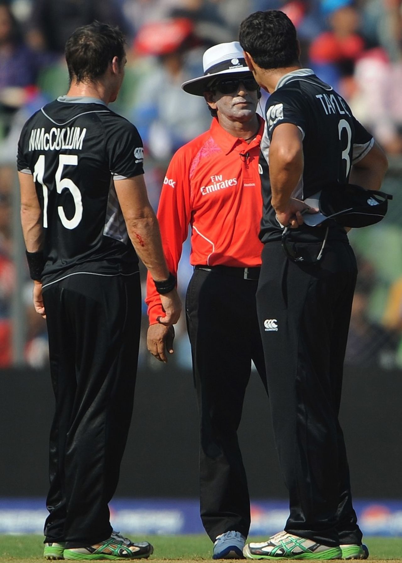 Ross Taylor and Nathan McCullum speak with umpire Asad Rauf, New Zealand v Sri Lanka, Group A, World Cup 2011, Mumbai, March 18, 2011