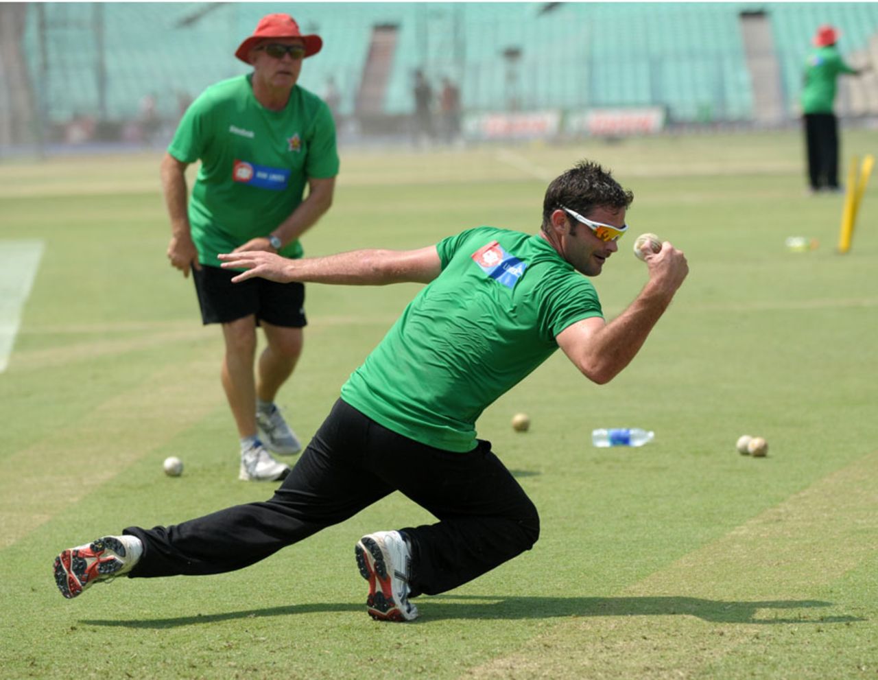 Greg Lamb is put through the paces during fielding practice, Kolkata, March 19, 2011