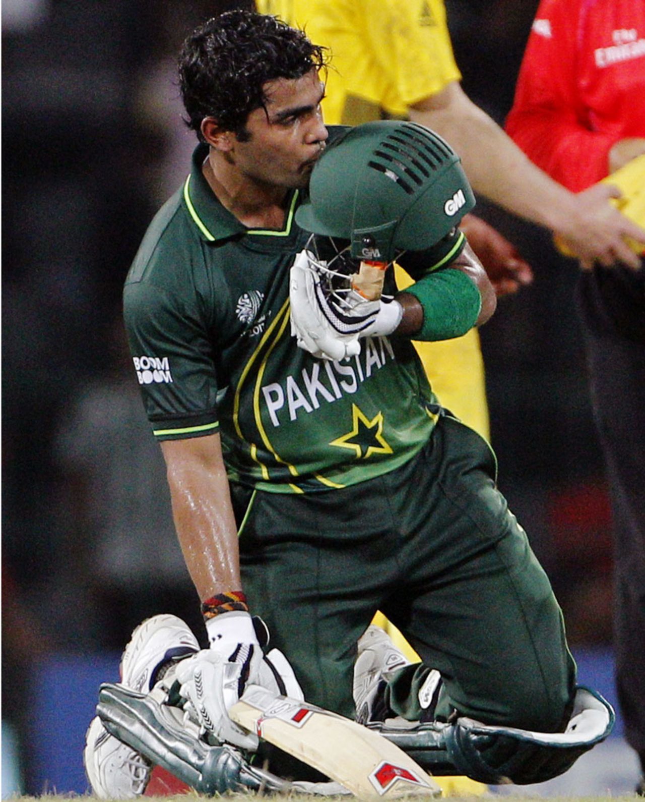 Umar Akmal kisses his helmet after Pakistan's win, Australia v Pakistan, Group A, World Cup 2011, Colombo, March 19, 2011