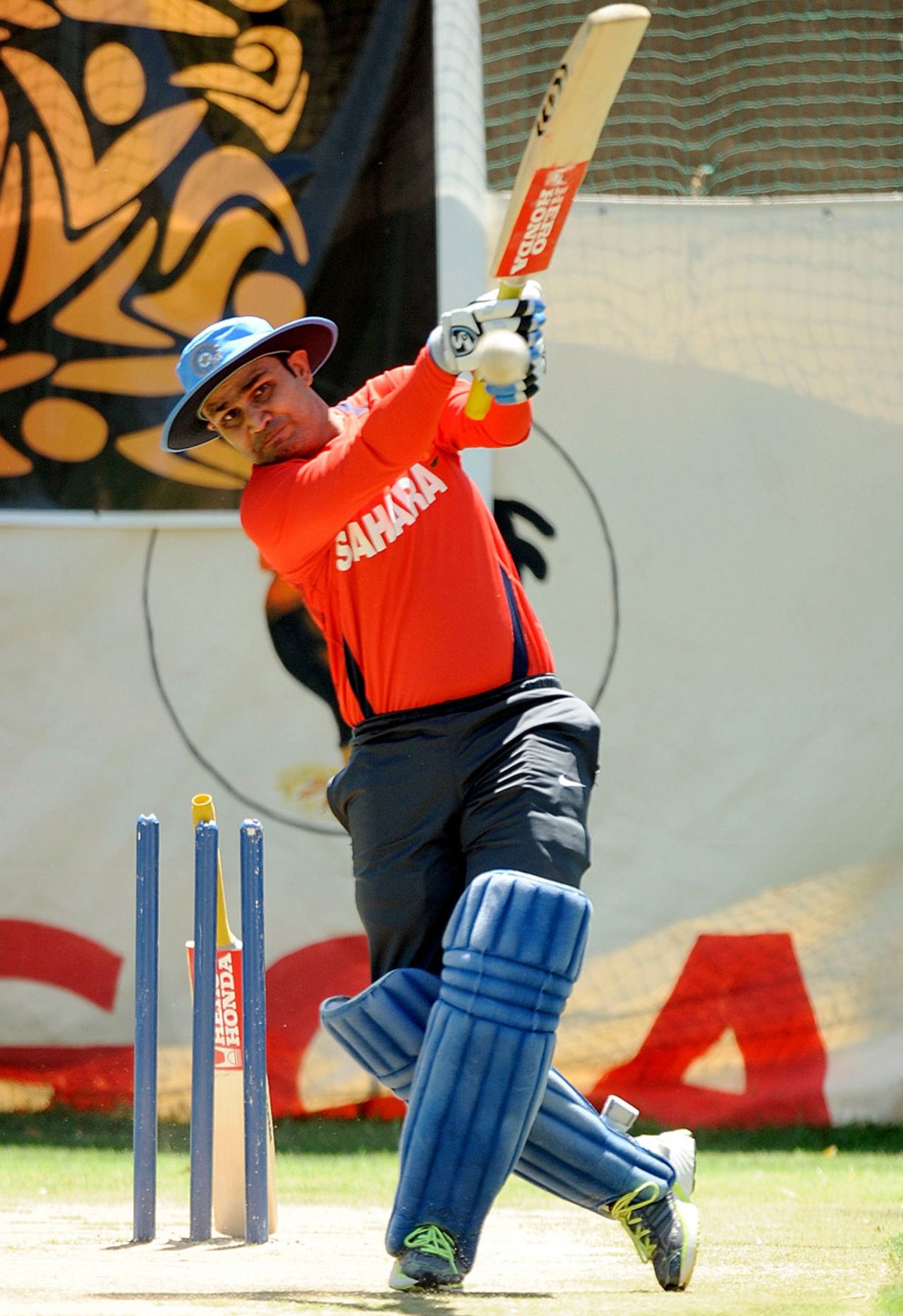 Virender Sehwag unleashes a big shot in the nets, World Cup, Ahmedabad, March 22, 2011