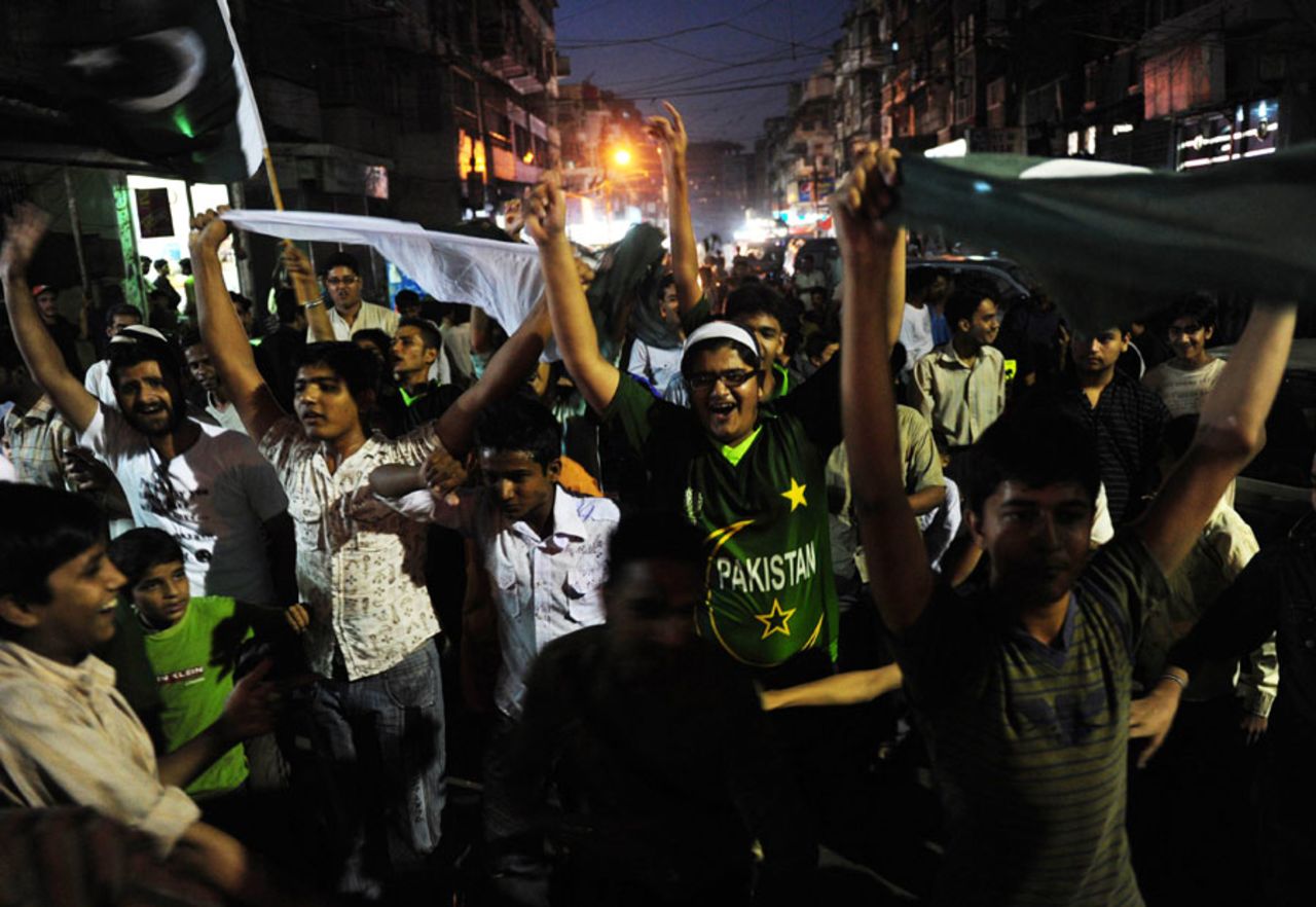 Fans in Islamabad wave flags in the street after Pakistan went through to the World Cup semi-finals, Islamabad, March 23, 2011