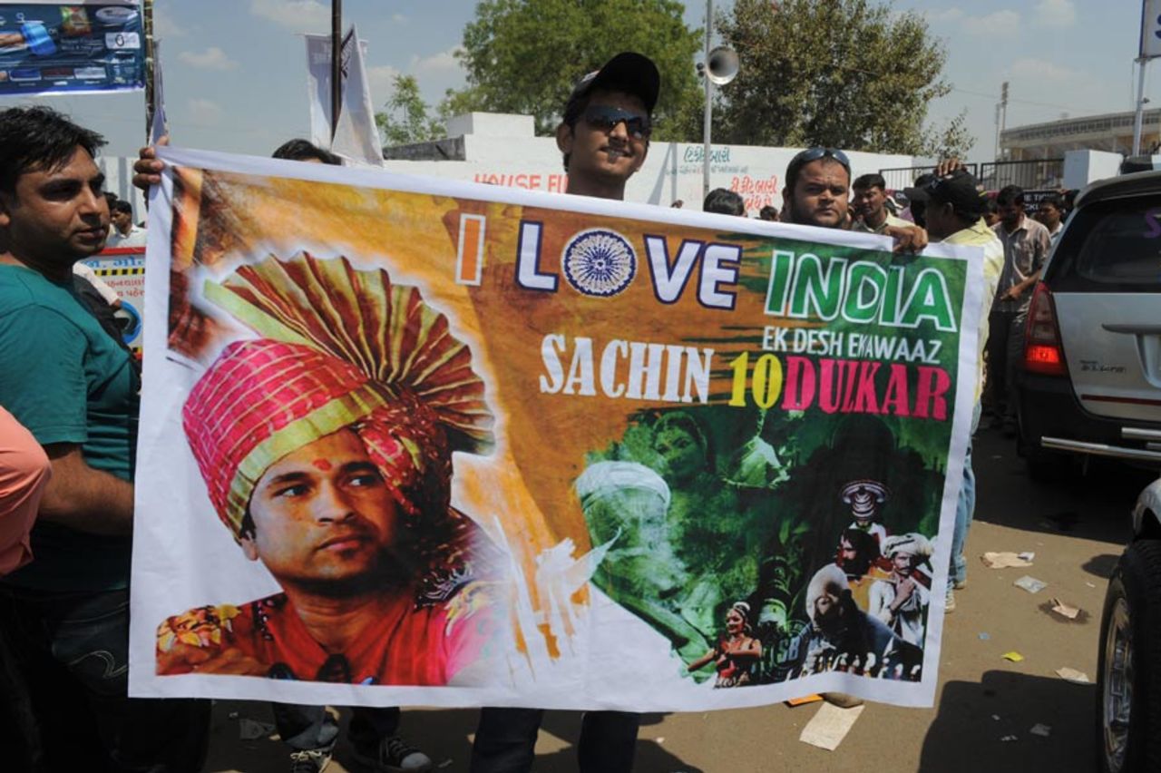A vendor sells posters of Sachin Tendulkar outside the Sadar Patel Stadium, Motera in Ahmedabad, March 24, 2011