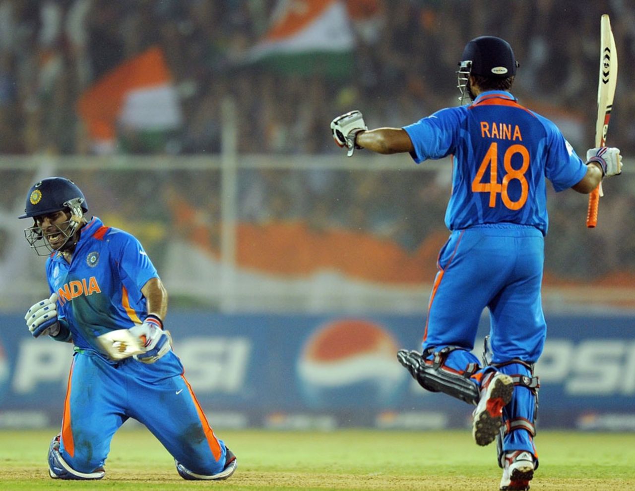 Yuvraj Singh and Suresh Raina celebrate India's win, India v Australia, 2nd quarter-final, Ahmedabad, World Cup 2011, March 24, 2011