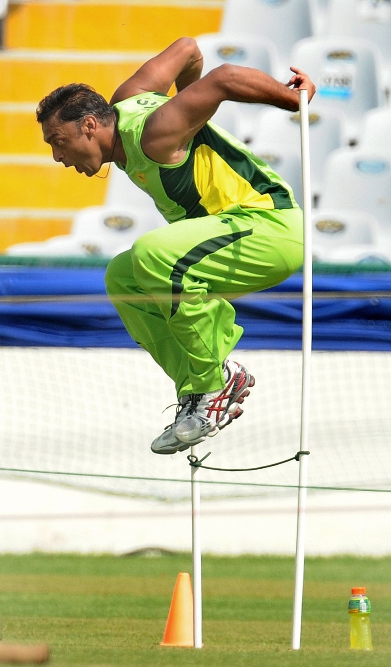 Shoaib Akhtar jumps over a hurdle during a training session , Mohali, World Cup 2011, March 26, 2011 