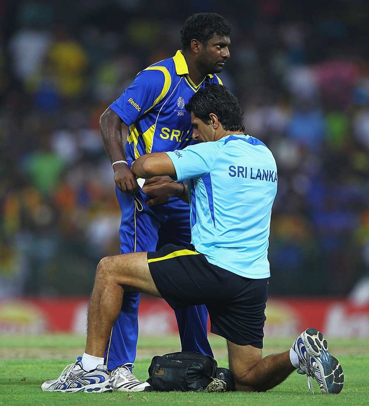 Muttiah Muralitharan needed treatment towards the end of the innings, Sri Lanka v England, 4th quarter-final, World Cup 2011, Colombo, March 26 2011