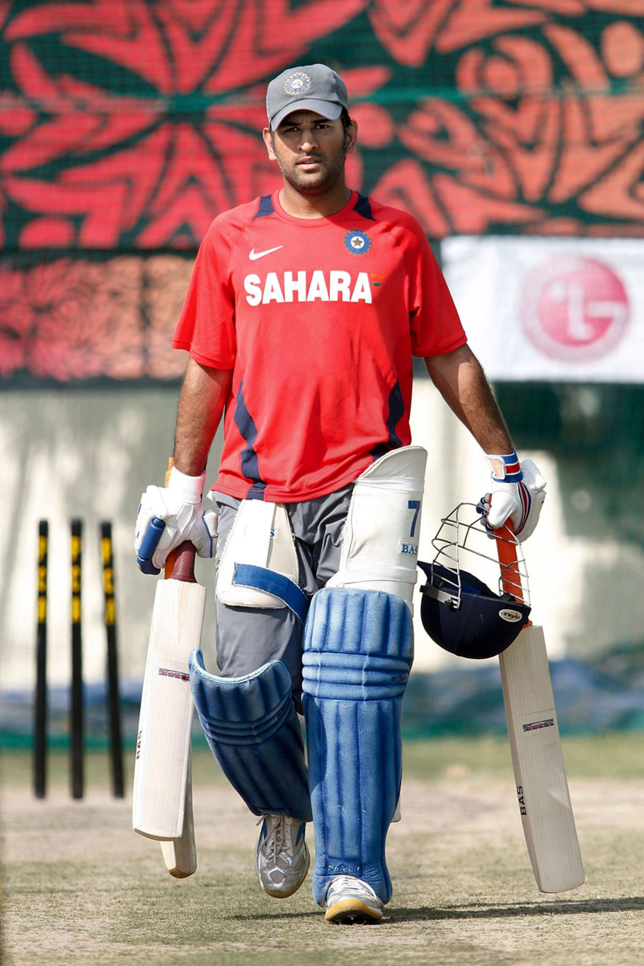 MS Dhoni heads for the batting nets, Mohali, March 28, 2011