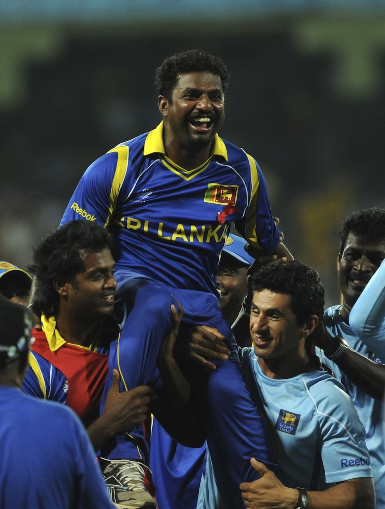 An injured Muttiah Muralitharan is given a ride, Sri Lanka v New Zealand, 1st semi-final, World Cup 2011, Colombo, March 29, 2011