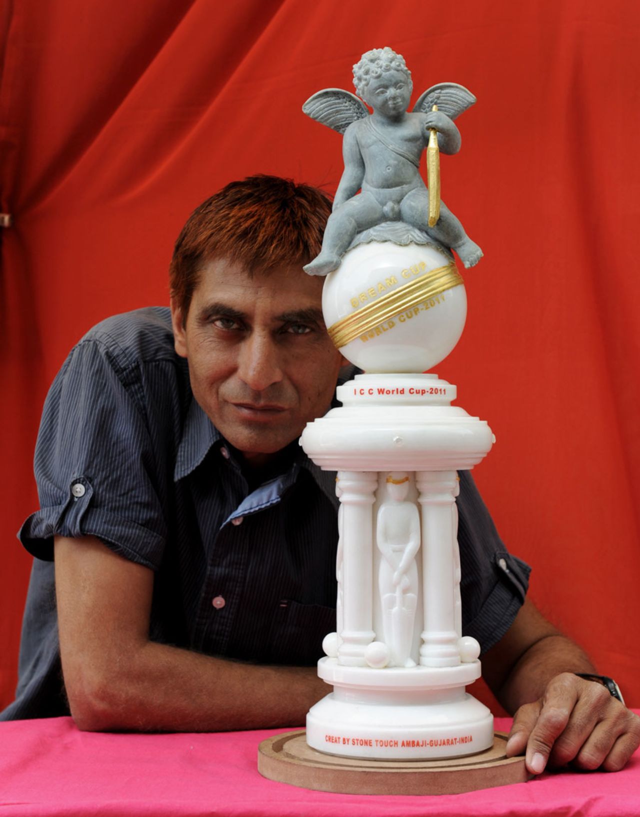 An Indian sculptor displays his interpretation of the World Cup in white and green marble, Ahmedabad, World Cup 2011, March 29, 2011