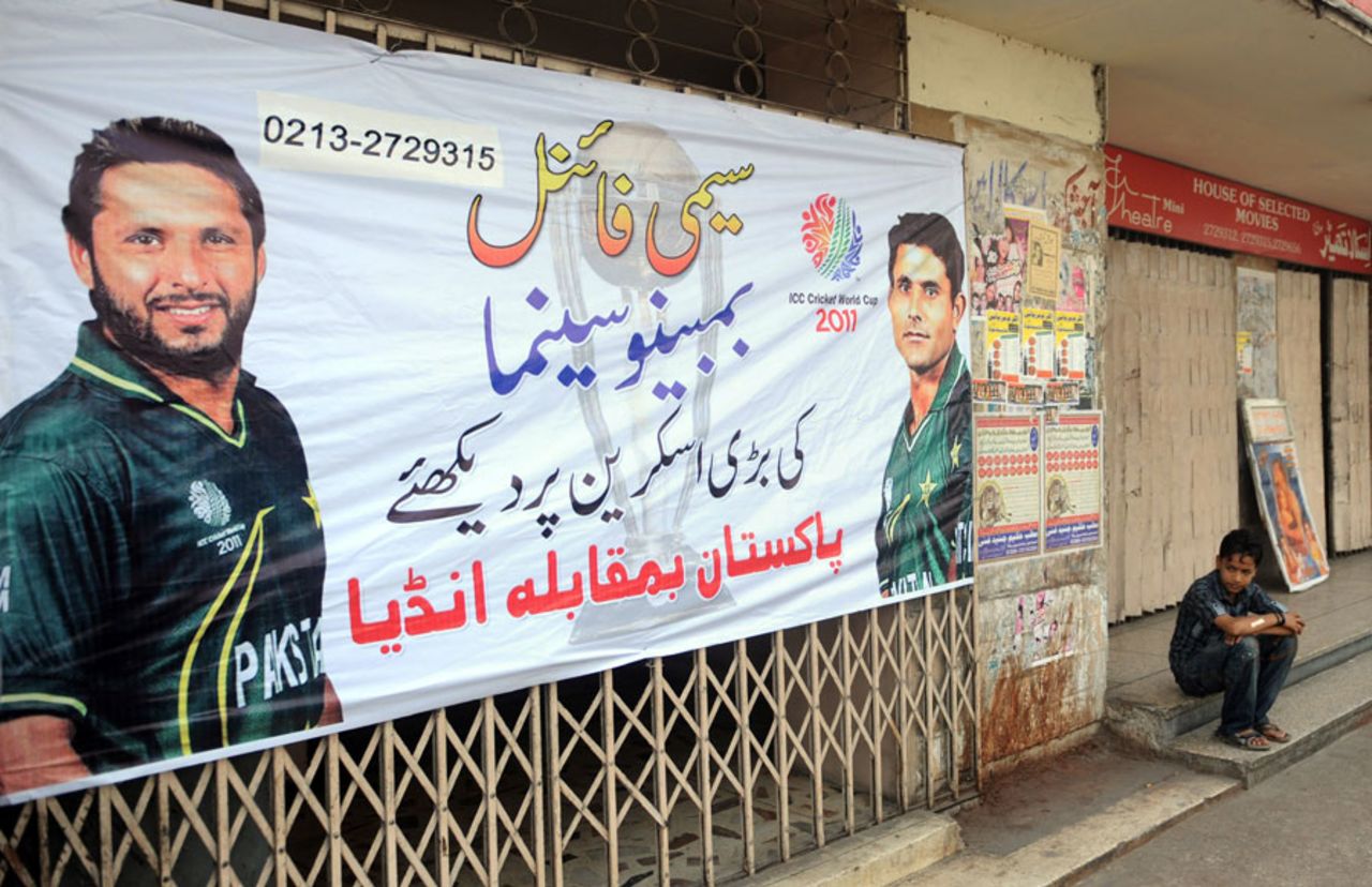 A cinema theatre in Karachi announces to passers-by that it will be screening the India-Pakistan match, World Cup 2011, March 29, 2011