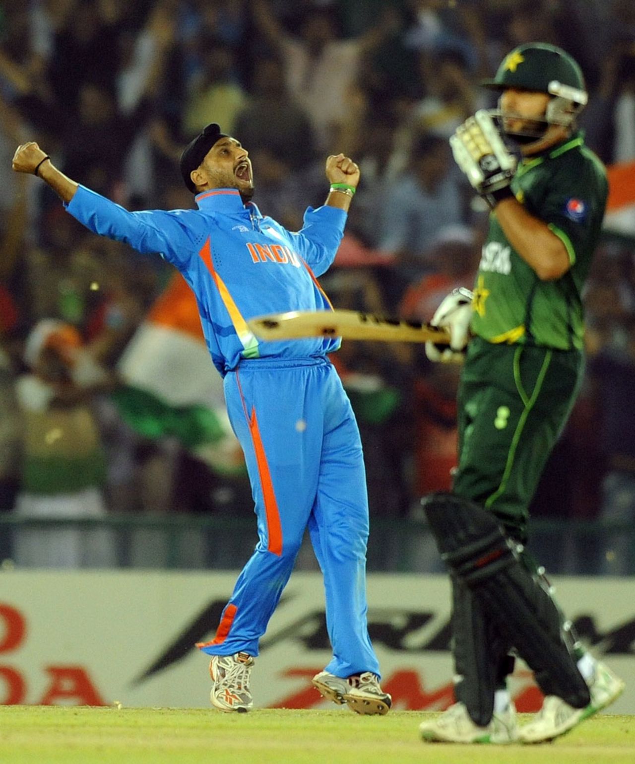 Contrasting emotions from Shahid Afridi and Harbhajan Singh after the former's dismissal, India v Pakistan, 2nd semi-final, World Cup 2011, Mohali, March 30, 2011
