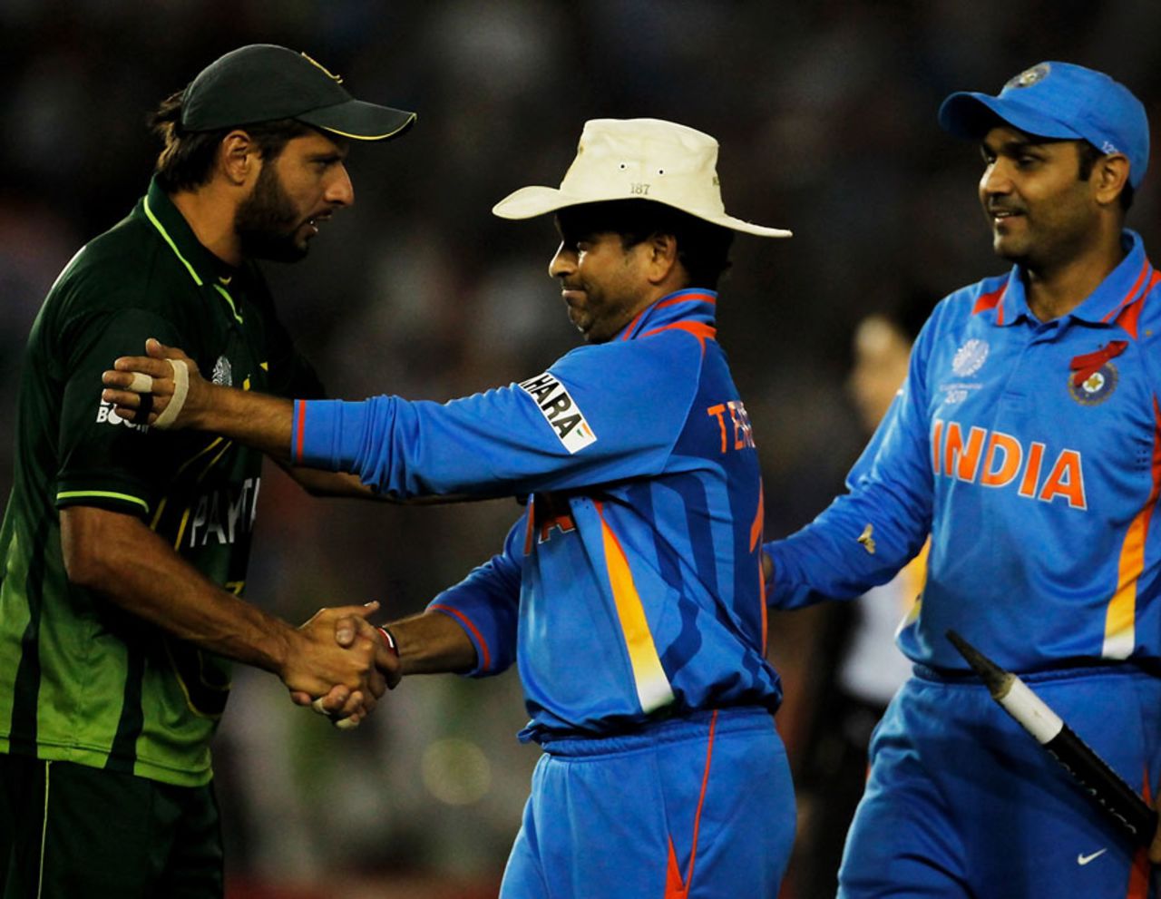 Shahid Afridi congratulates Sachin Tendulkar and Virender Sehwag after the hard-fought game, India v Pakistan, 2nd semi-final, World Cup 2011, Mohali, March 30, 2011