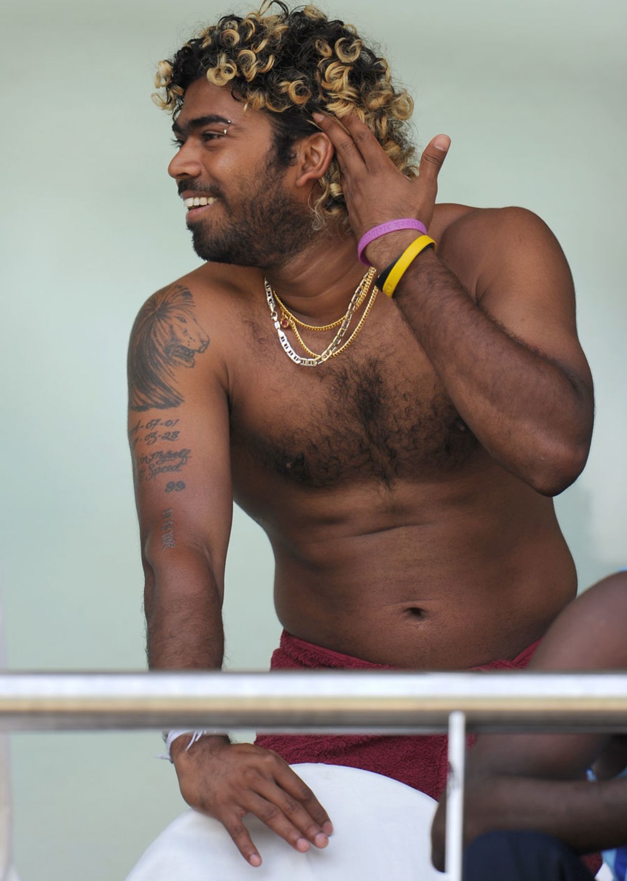 Lasith Malinga enjoys a lighter moment on the team balcony, Mumbai, April 1 2011