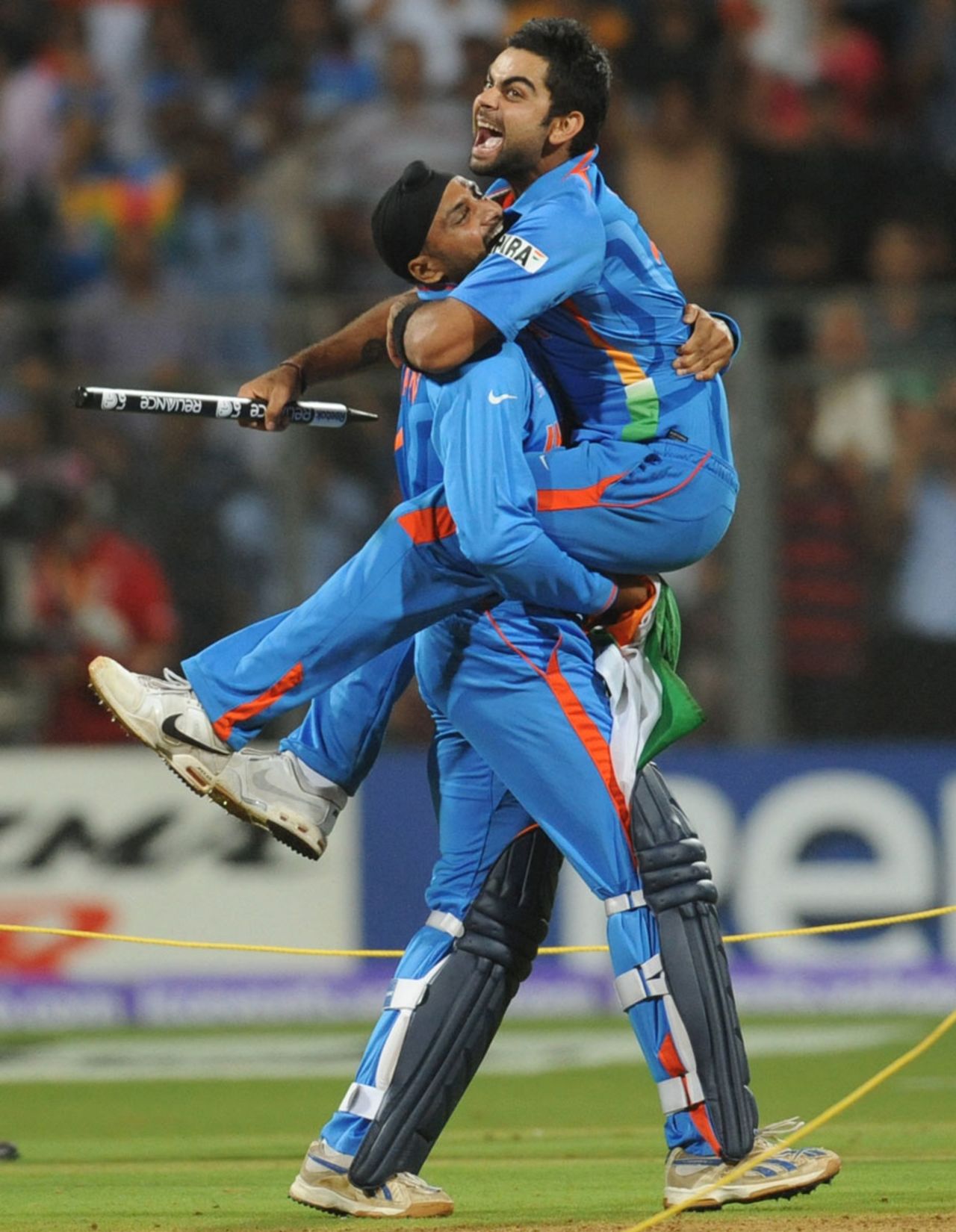 Harbhajan Singh and Virat Kohli can barely contain their glee, India v Sri Lanka, final, World Cup 2011, Mumbai, April 2, 2011