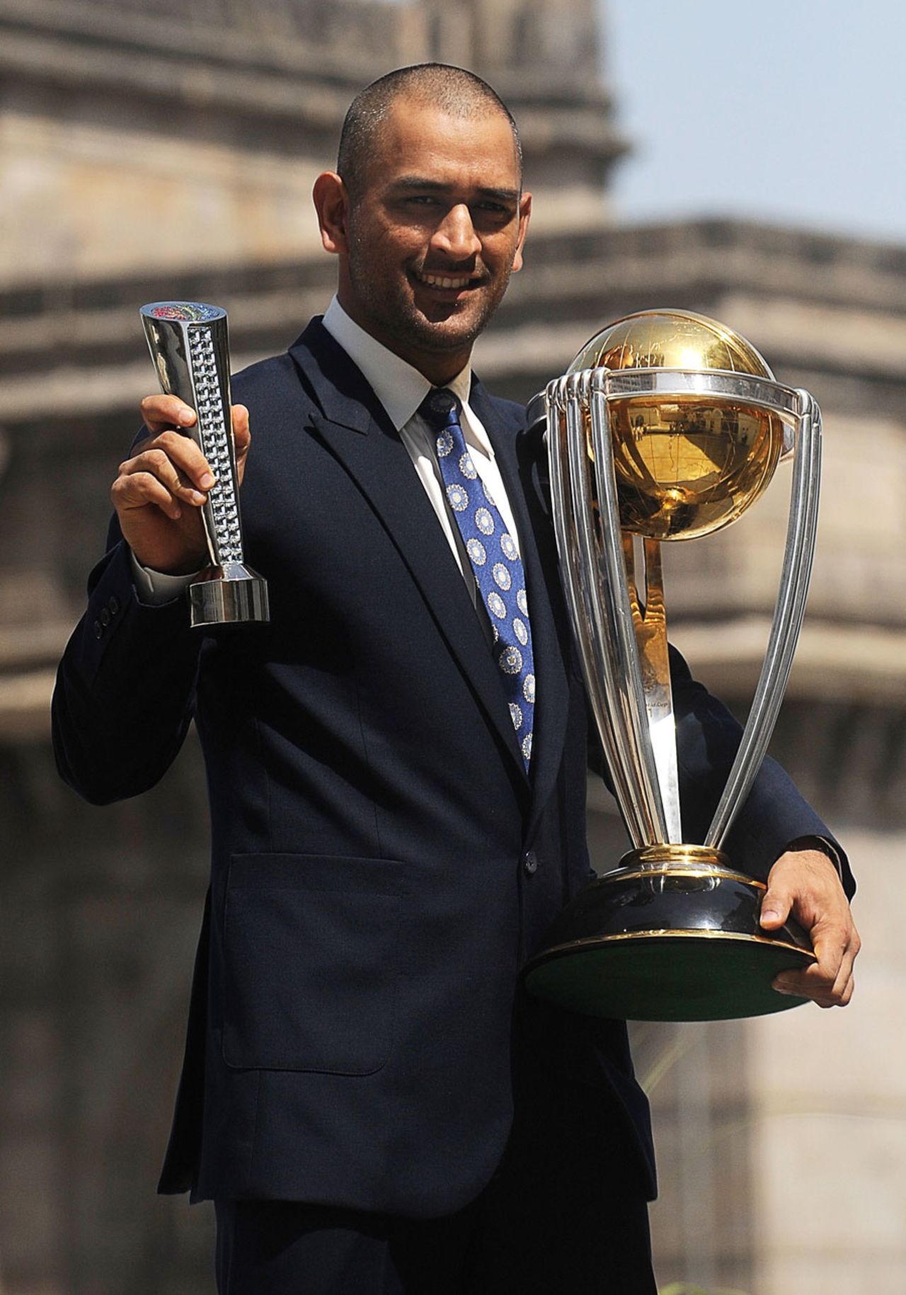 MS Dhoni with the World Cup trophy and his Man of the Match award from the final, Mumbai, April 3, 2011