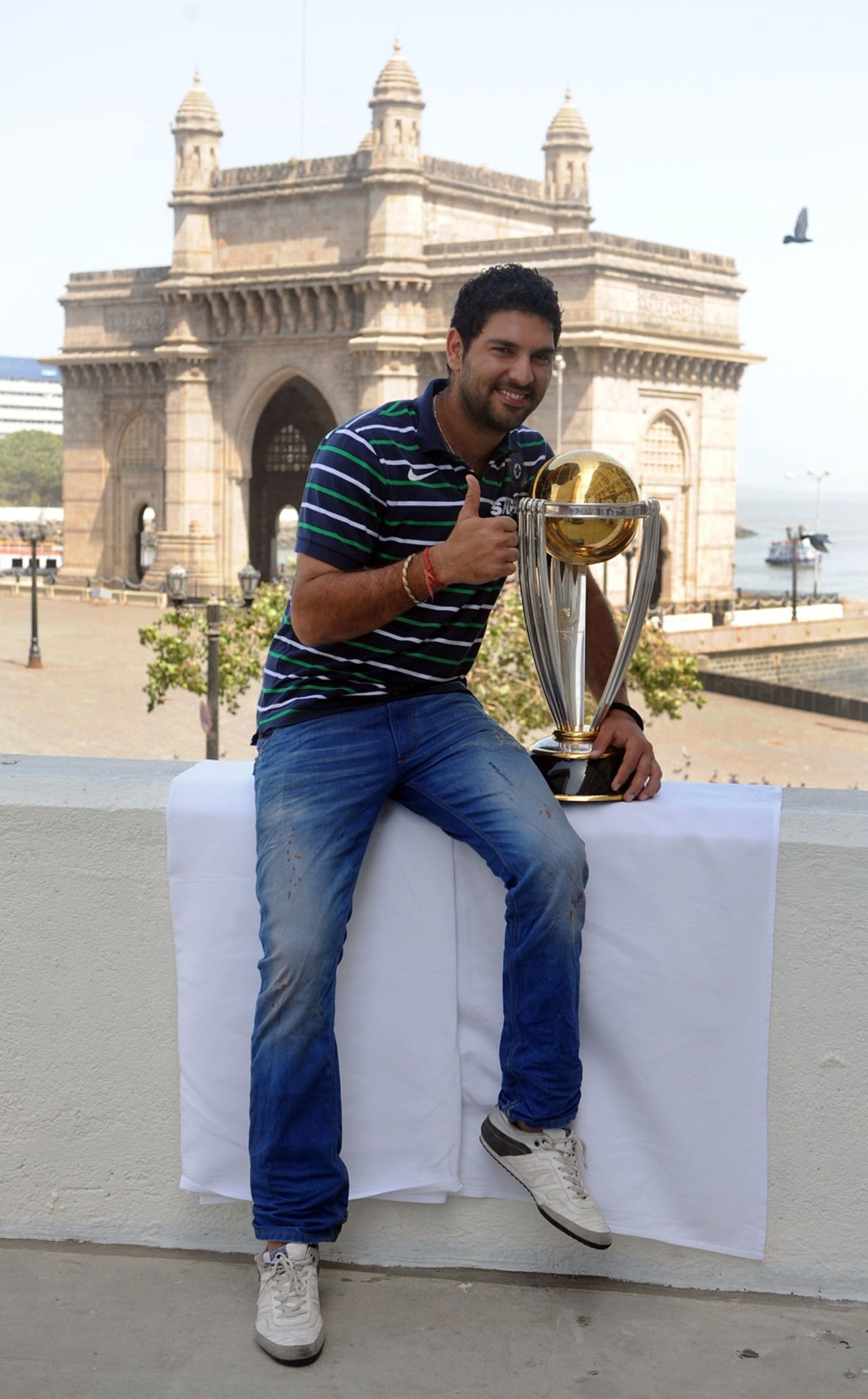 Yuvraj Singh with the World Cup trophy in front of the Gateway of India, Mumbai, April 3, 2011