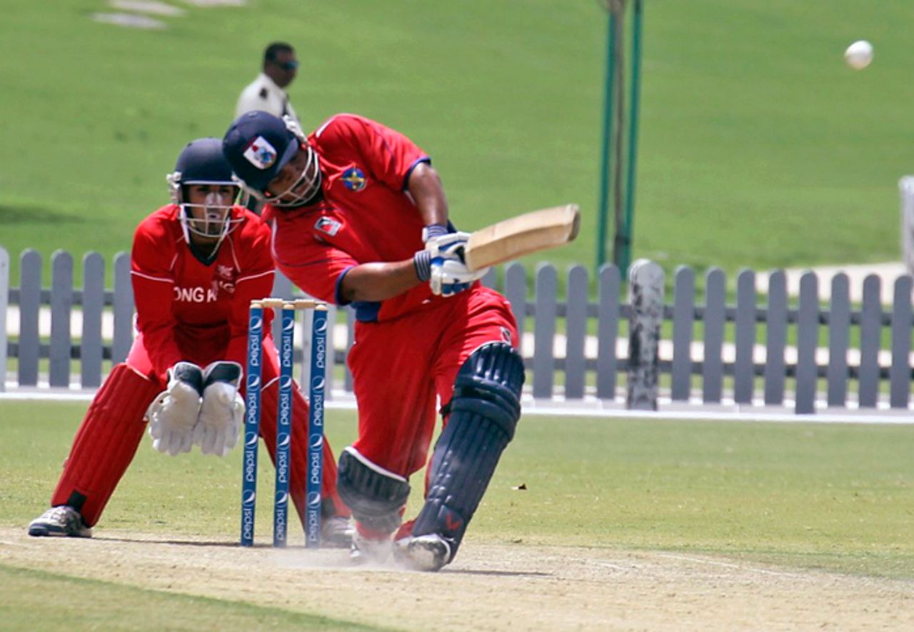 Bermuda's Jason Anderson hits a six during his unbeaten 106 against Hong Kong at the ICC WCL Division 2 in Dubai on 9th April 2011