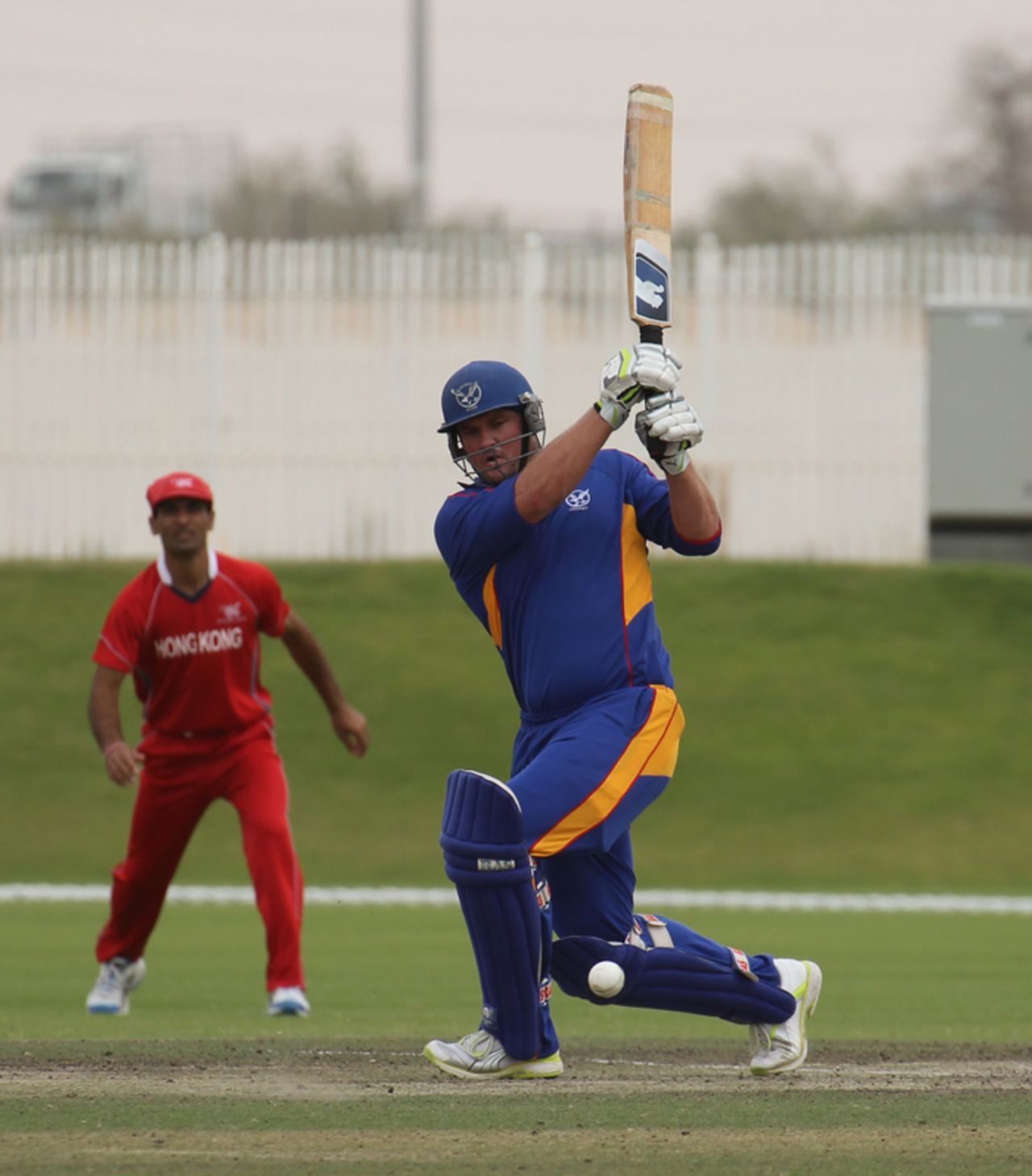 AJ Burger slugs a boundary through mid-wicktet for Namibia XI against Hong Kong XI in a WCL2 warm-up game at the Emirates Sevens ground on 5th April 2011