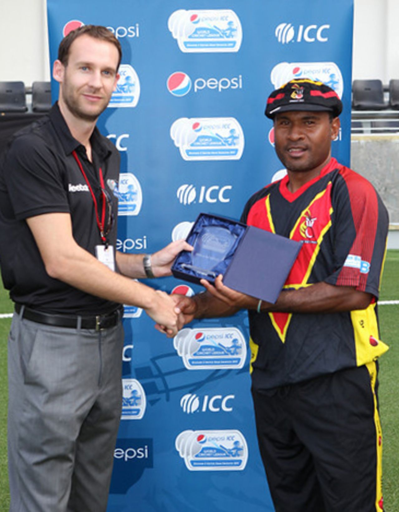 PNG skipper Rarua Dikana receives his Man of the Match award from ICC WCL2 Tournament Director Edward Fitzgibbon after leading his team to victory over Hong Kong on 12th April 2011