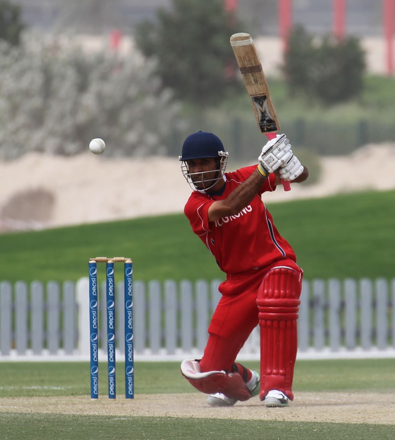 Hussain Butt drives the ball against PNG in the 3rd/4th Play-off match at the ICC WCL2 in Dubai on 15th April 2011