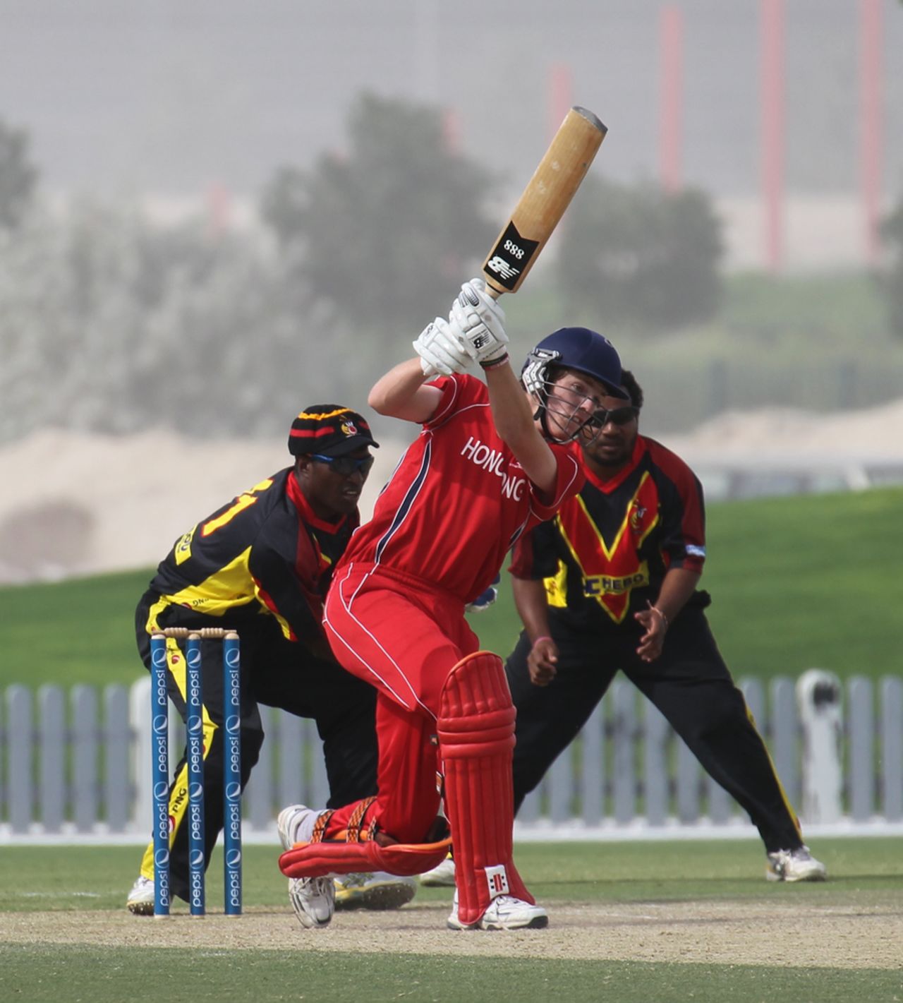 Max Tucker drives against PNG in the 3rd/4th Play-off match at the ICC WCL2 in Dubai on 15th April 2011