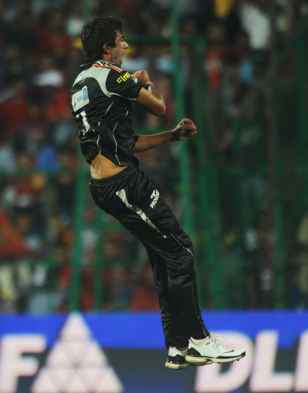 Rahul Sharma leaps after dismissing Chris Gayle, Royal Challengers Bangalore v Pune Warriors, IPL 2011, Bangalore, April 29, 2011