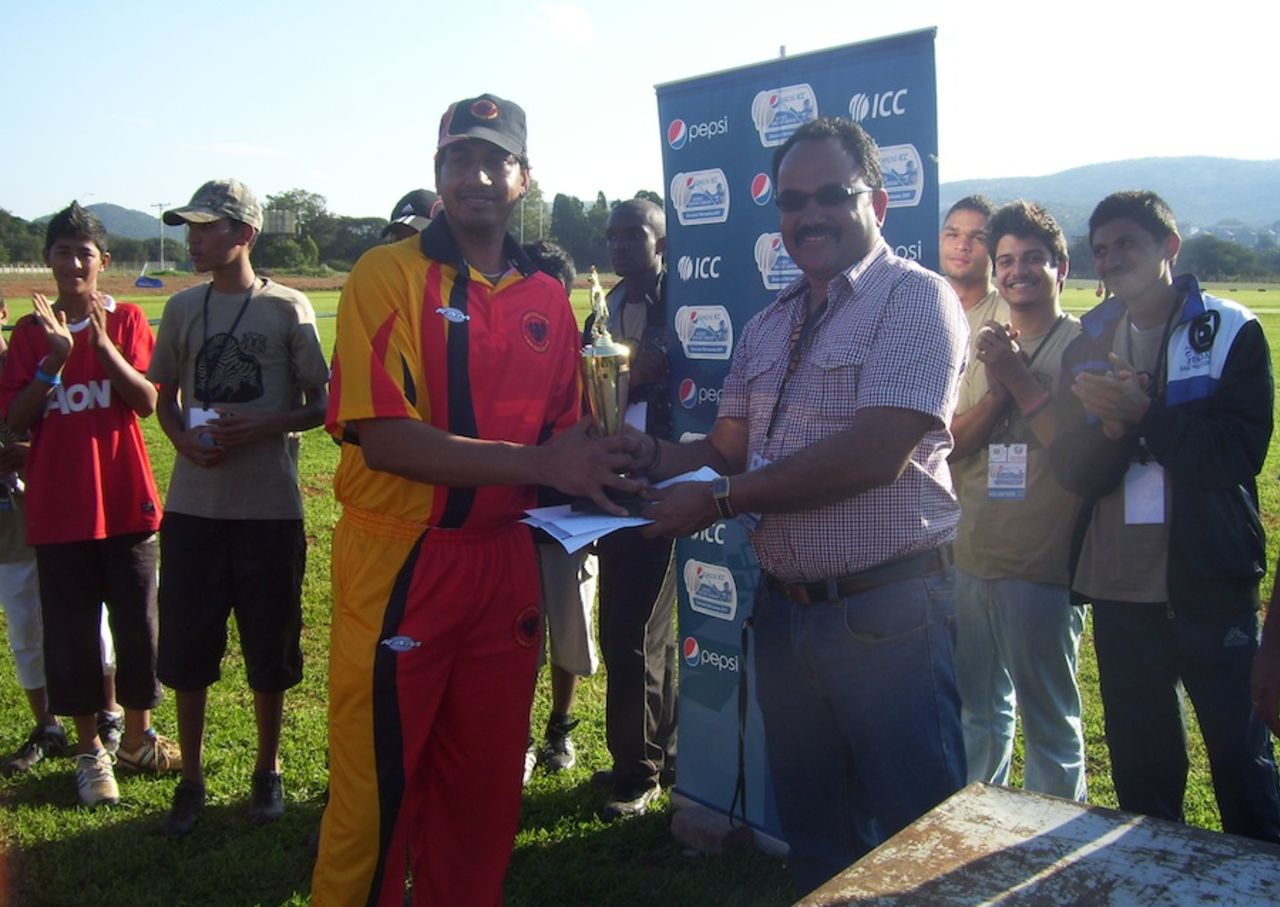 Madhu Menon, Chairman of Lobatse Cricket Club, presents Germany's Rana-Javed Iqbal a trophy, Japan v Germany, ICC World Cricket League Division Seven, Gaborone, Botswana, May 1, 2011 
