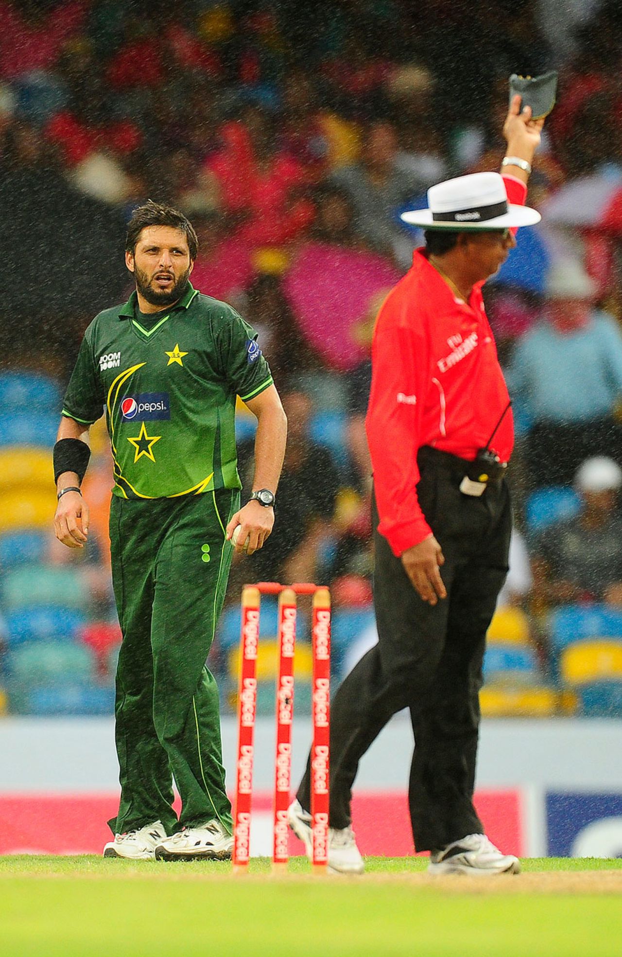 Shahid Afridi watches as Asoka de Silva calls for the covers, West Indies v Pakistan, 4th ODI, Barbados, May 2, 2011