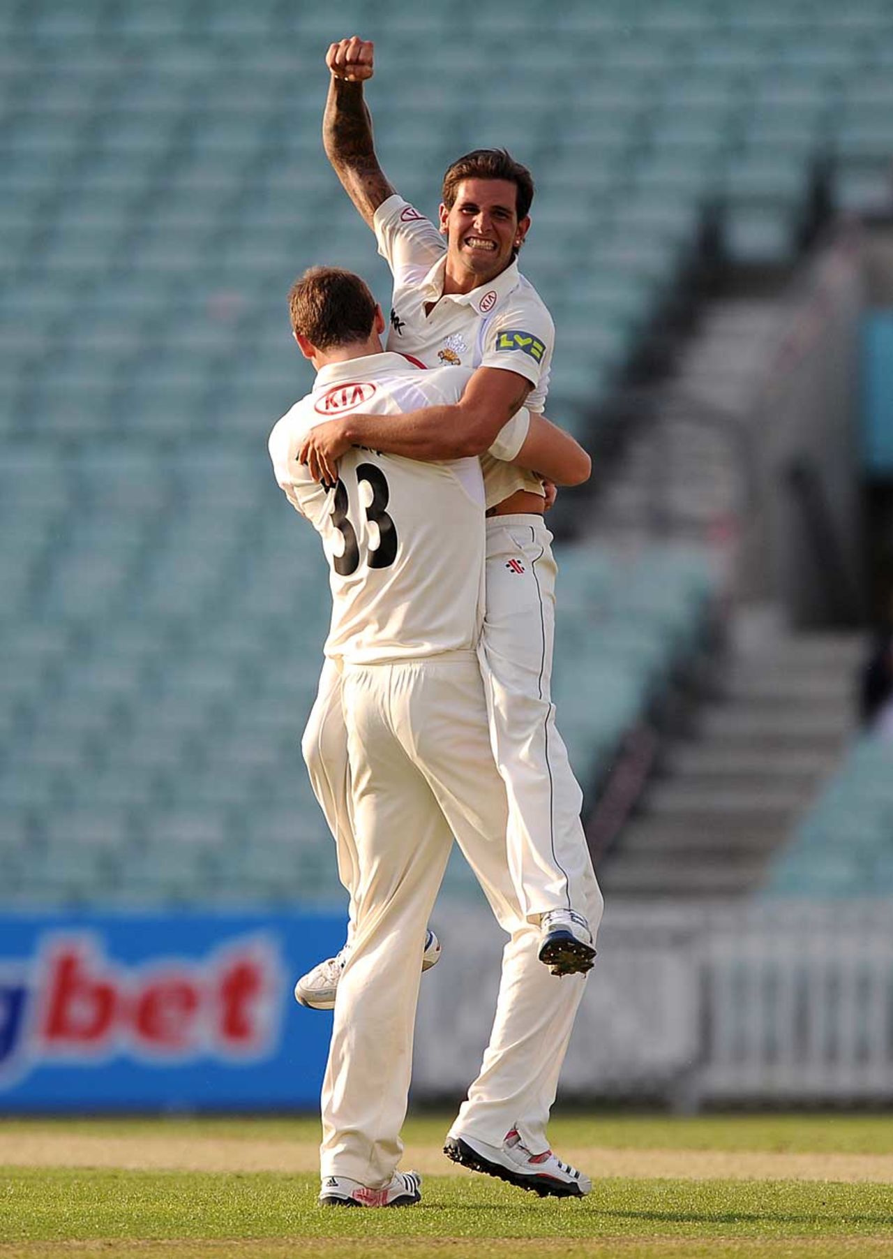 Jade Dernbach celebrates victory with Chris Tremlett, Surrey v Leicestershire, County Championship, Division Two, The Oval, May 6, 2011