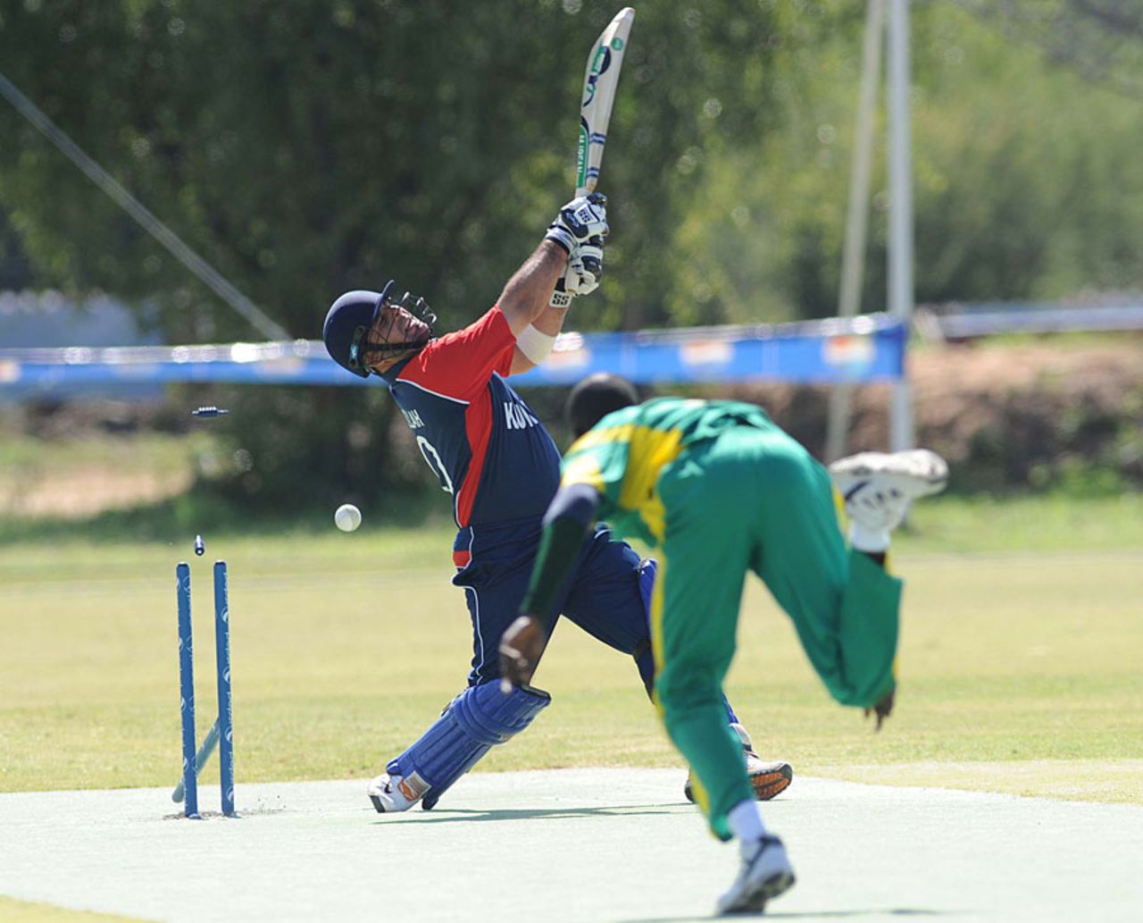 Abdullah Akhunzada is bowled by Saheed Akolade, Kuwait v Nigeria , World Cricket League Division 7 Final, Gaborone, May 8, 2011