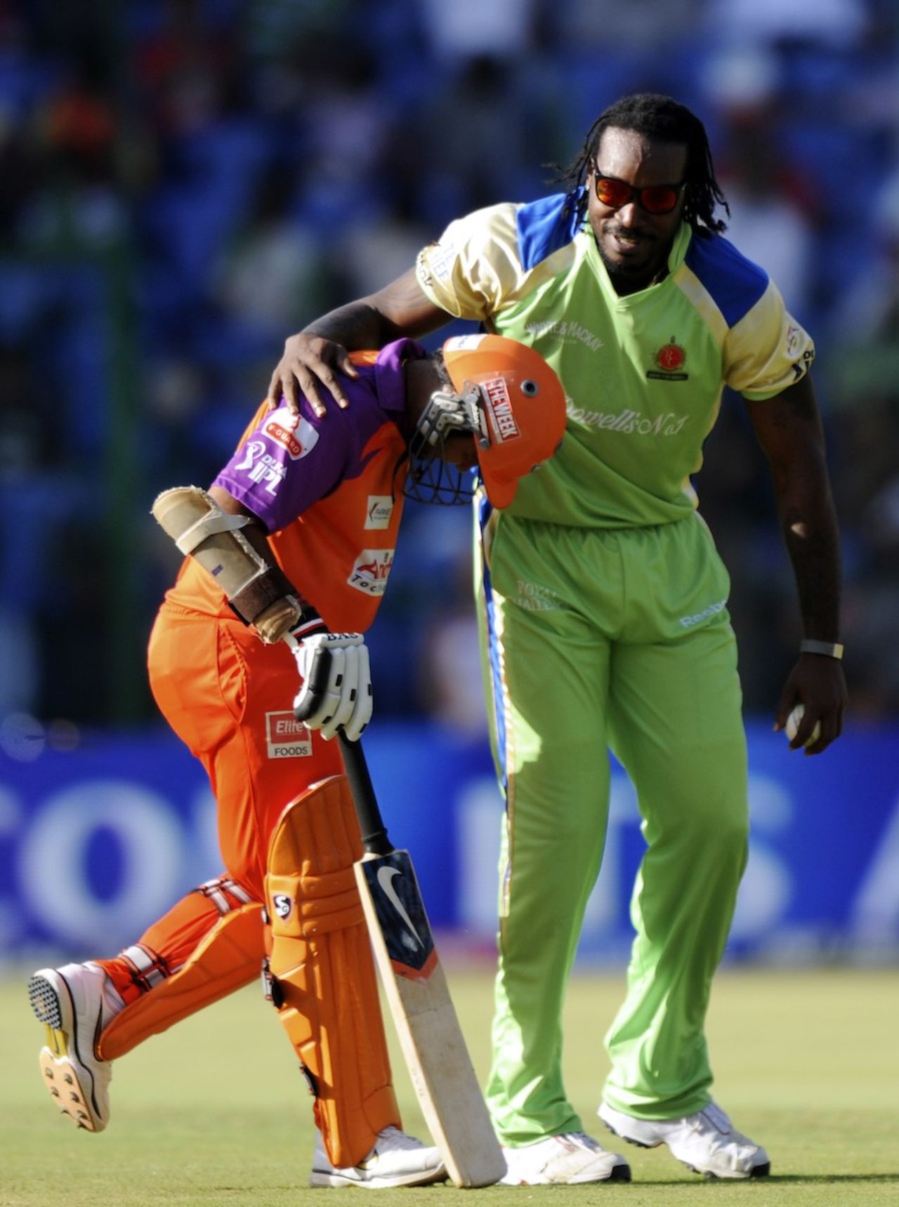 Chris Gayle puts an arm around Parthiv Patel, Bangalore v Kochi, IPL 2011, Bangalore, May 8, 2011