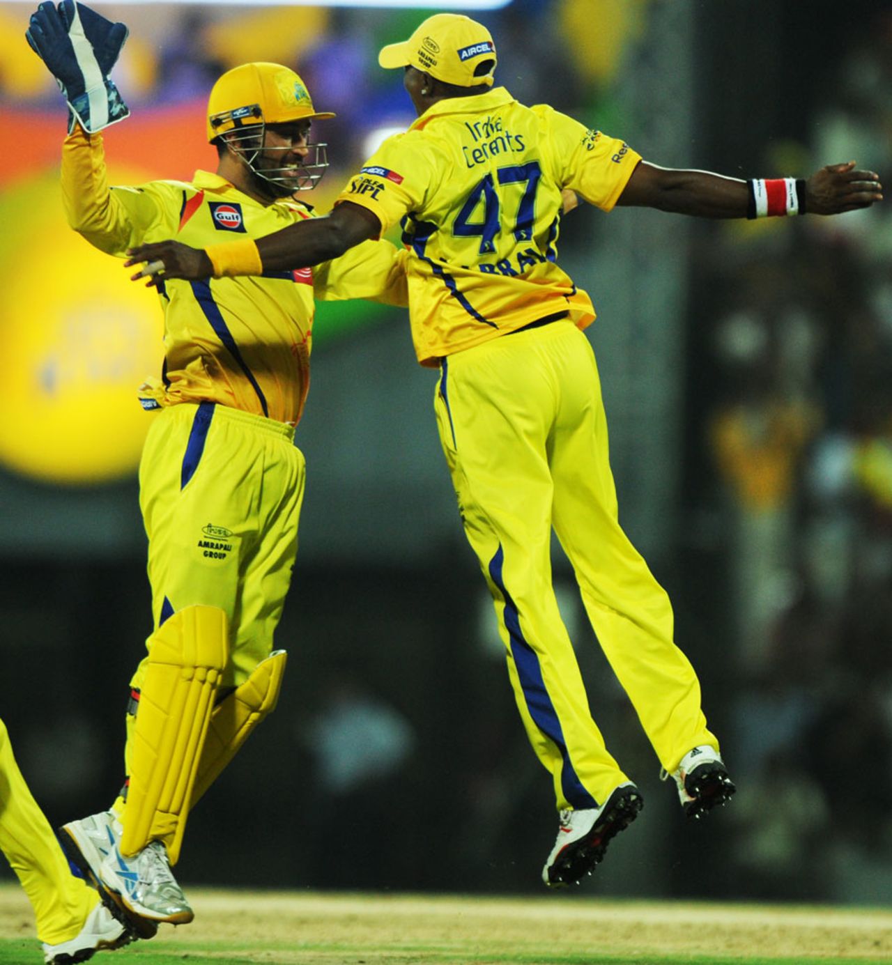 MS Dhoni and Dwayne Bravo celebrate after the latter took a stunner, Chennai Super Kings v Delhi Daredevils, IPL 2011, Chennai, May 12, 2011