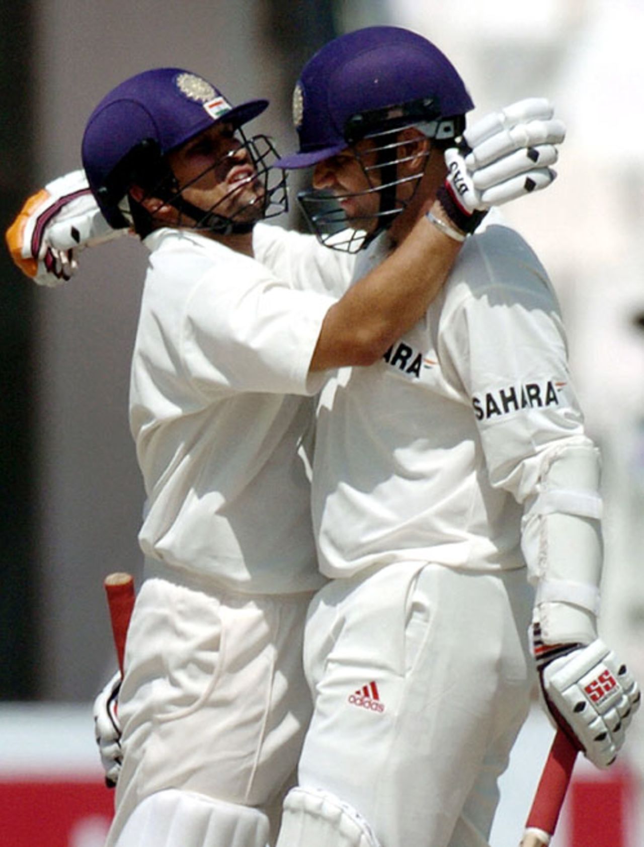 Virender Sehwag is congratulated by Sachin Tendulkar after getting to his triple-century, Pakistan v India, 1st Test, Multan, 2nd day, March 29, 2004