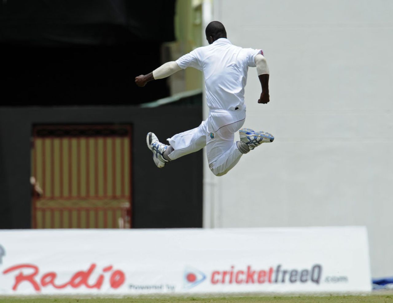 Darren Sammy leaps in celebration of Mohammad Salman's wicket, West Indies v Pakistan, 1st Test, Providence, 4th day, May 15, 2011