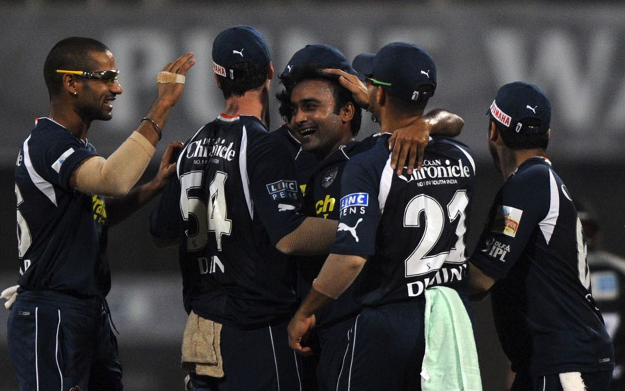 Amit Mishra is mobbed by his team-mates after taking two wickets in an over, Pune Warriors v Deccan Chargers, IPL 2011, Navi Mumbai, May 16 2011