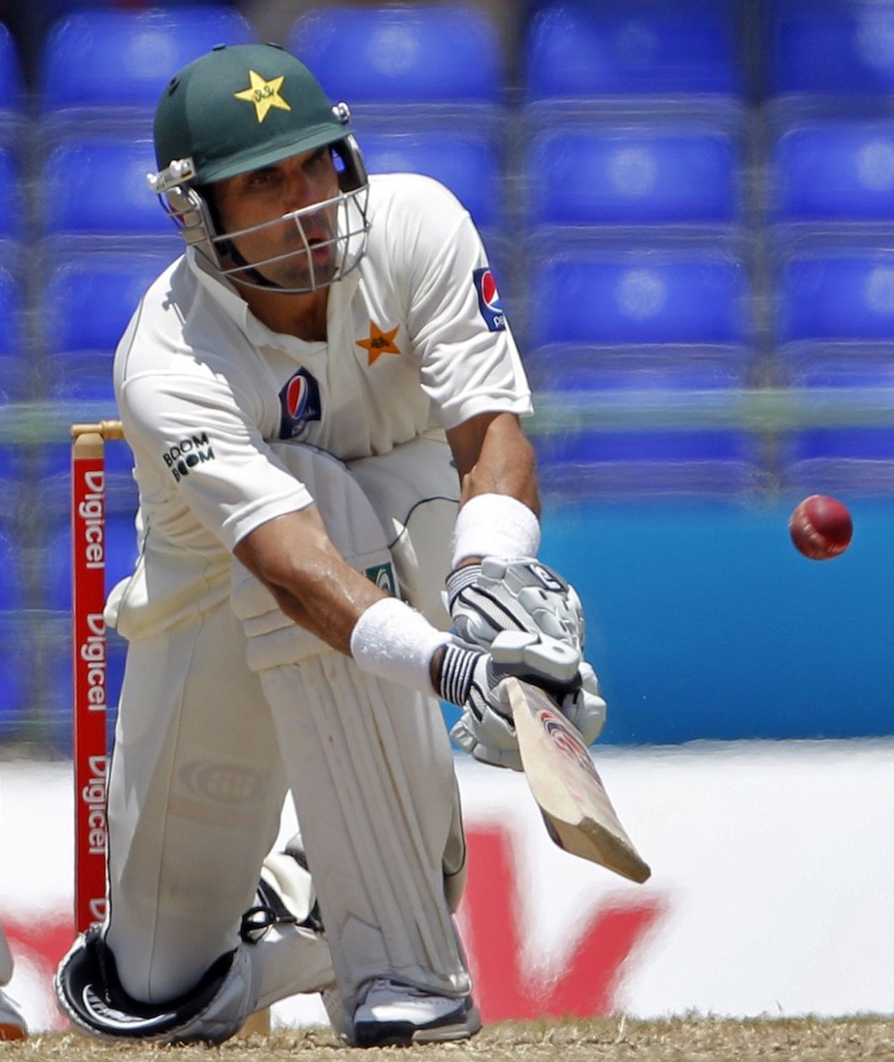 Misbah-ul-Haq gets down low to paddle the ball, West Indies v Pakistan, 2nd Test, St Kitts, 4th day, May 23, 2011