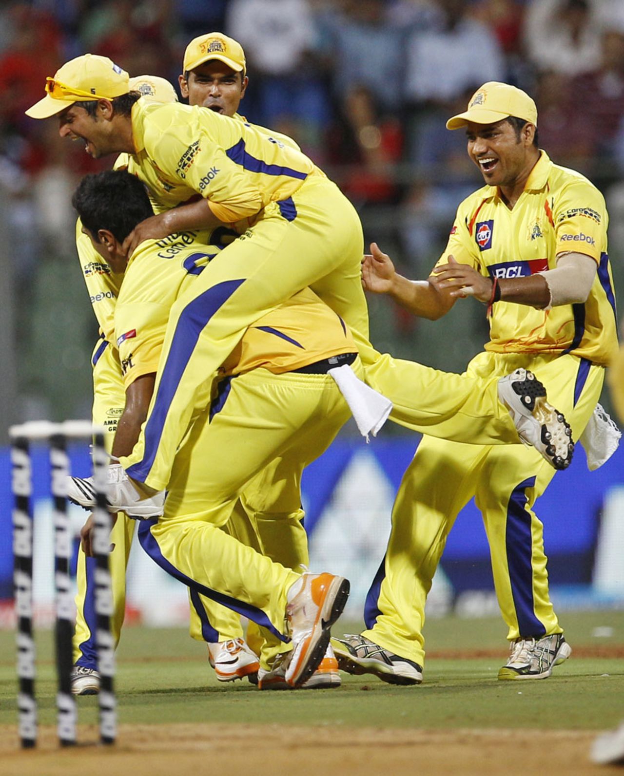 R Ashwin is mobbed by his team-mates after getting Chris Gayle, Bangalore v Chennai, 1st qualifier, IPL 2011, Mumbai, May 24, 2011