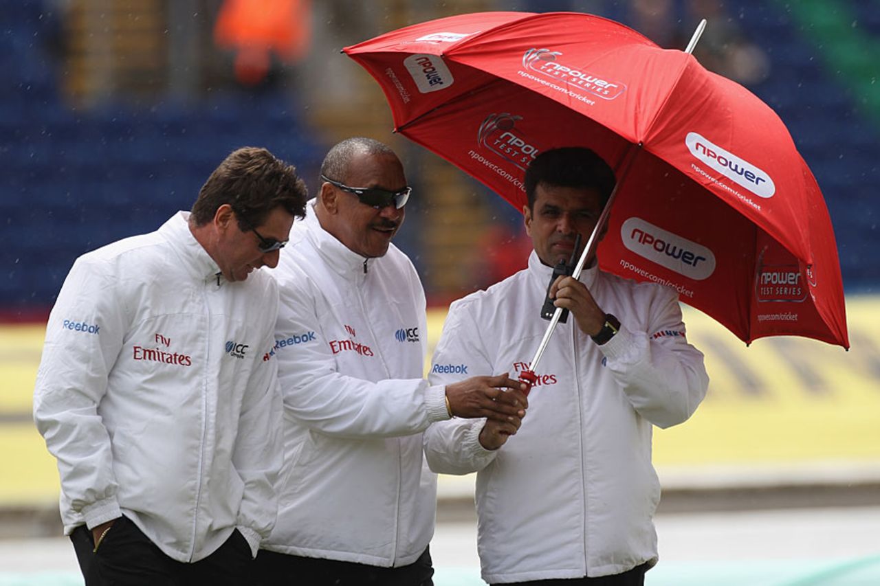 The umpires made regular inspections on the first morning, England v Sri Lanka, 1st Test, Cardiff, 1st day, May 26 2011