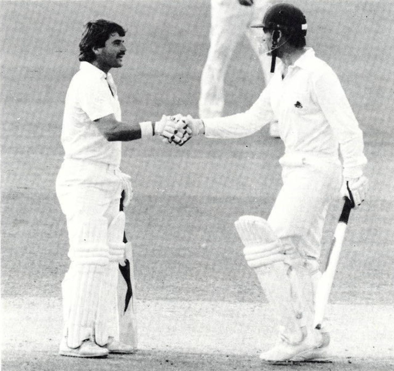 An unusual celebration ... Pat Pocock is congratulated by Allan Lamb on his first international run of the summer in his fifth innings, England v Sri Lanka, Lord's, August 27, 1984