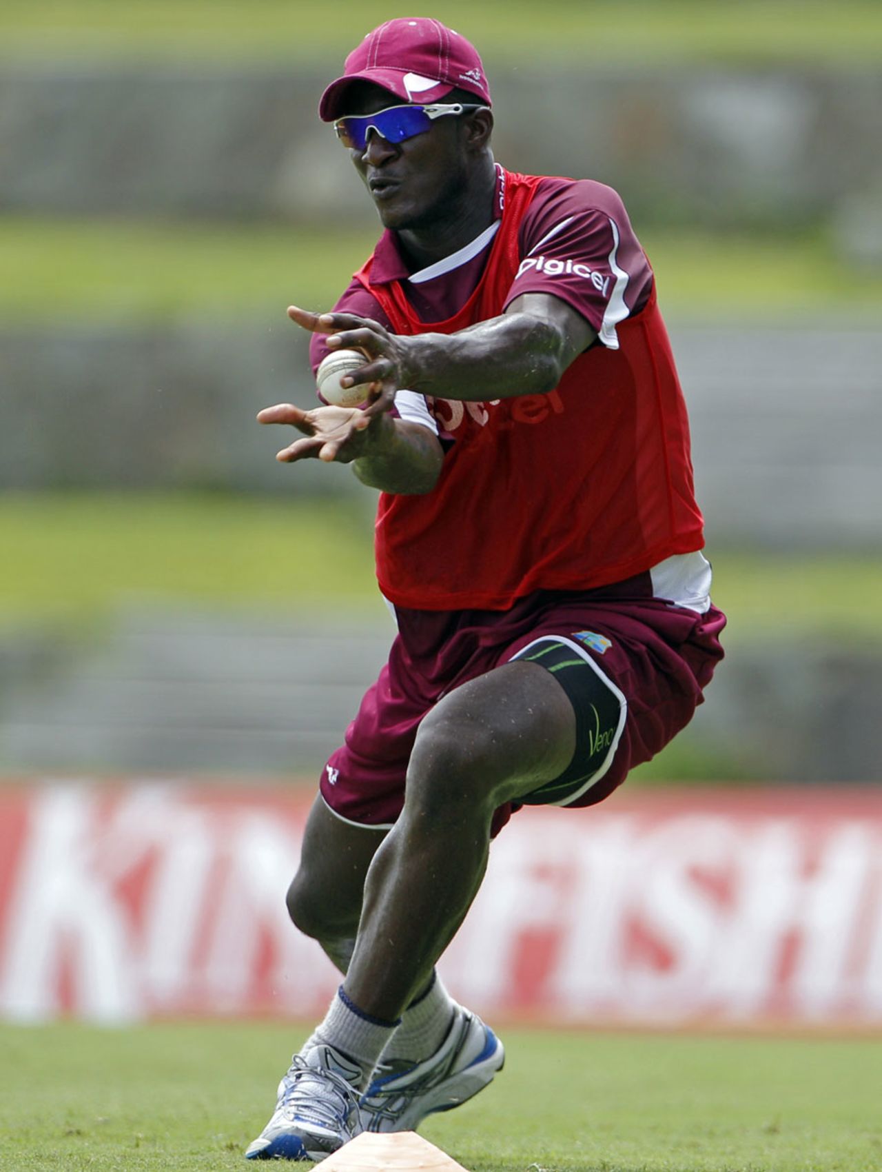 A ball is about to disappear into Darren Sammy's hands during practice, West Indies v India, Antigua, June 10, 2011