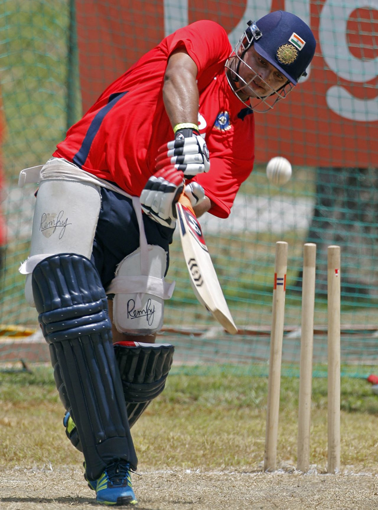 Suresh Raina lofts a delivery during batting practice, West Indies v India, Antigua, June 10, 2011