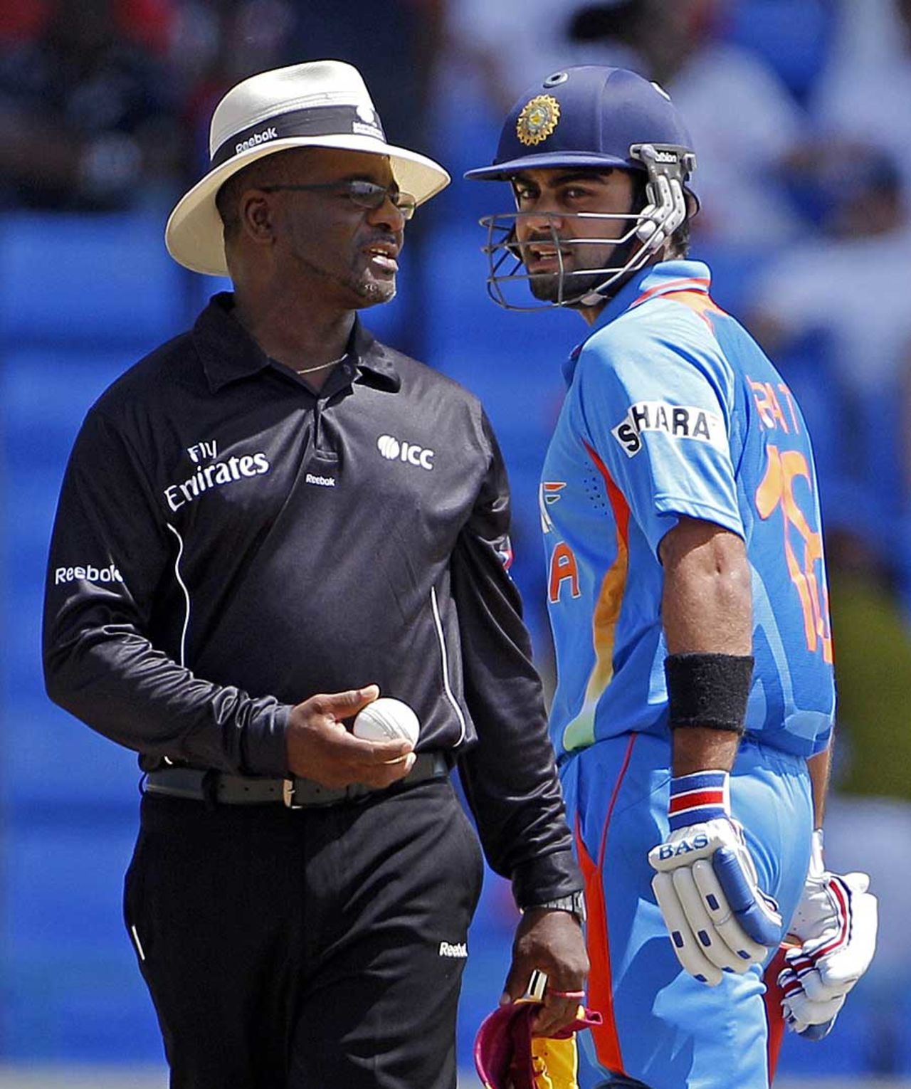 Virat Kohli has a word with umpire Normal Malcolm after he was given out lbw first ball, West Indies v India, 3rd ODI, Antigua, June 11, 2011