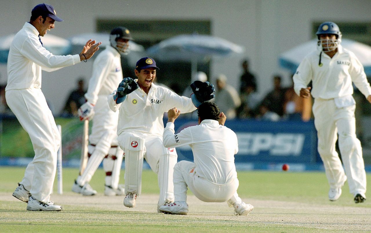Parthiv Patel and Sachin Tendulkar celebrate Moin Khan's wicket, Pakistan v India, first Test, day three, Multan, March 30, 2004