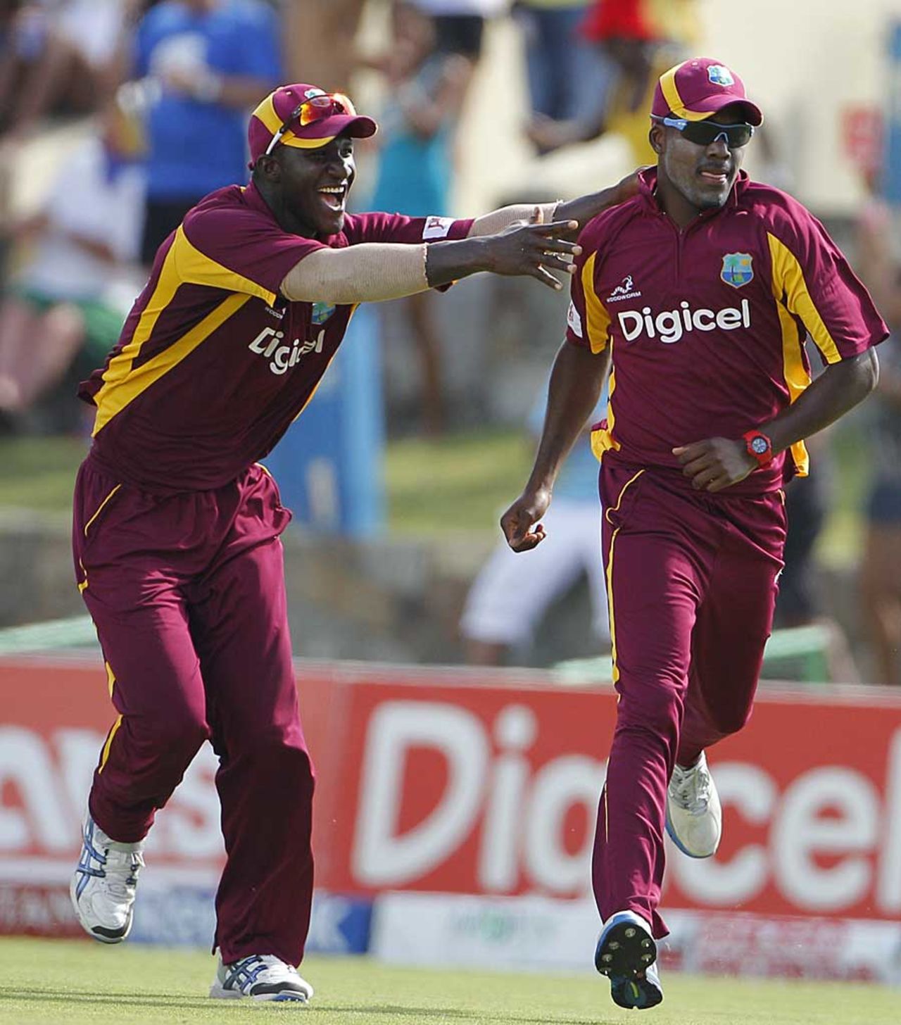 Darren Sammy and Darren Bravo celebrate the fall of Rohit Sharma, West Indies v India, 4th ODI, Antigua, June 13, 2011