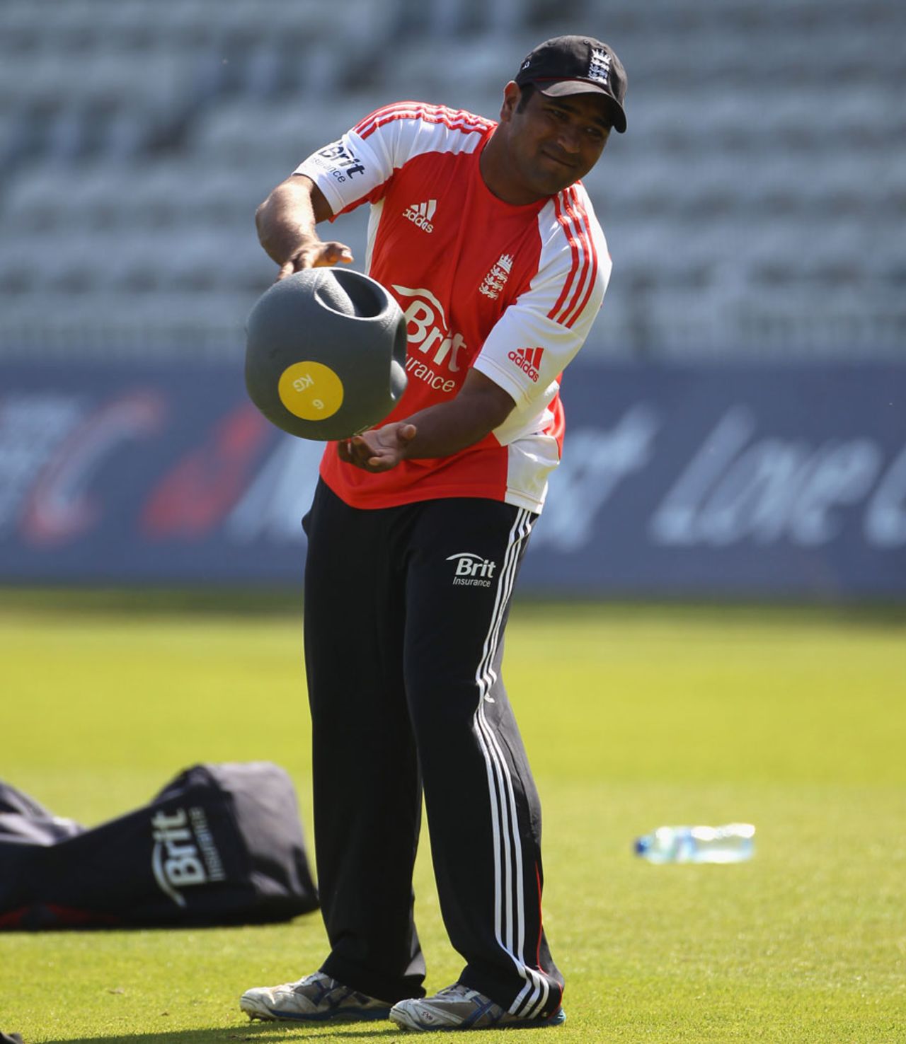 Samit Patel hurls a medicine ball during the training session, The Oval, June 27, 2011