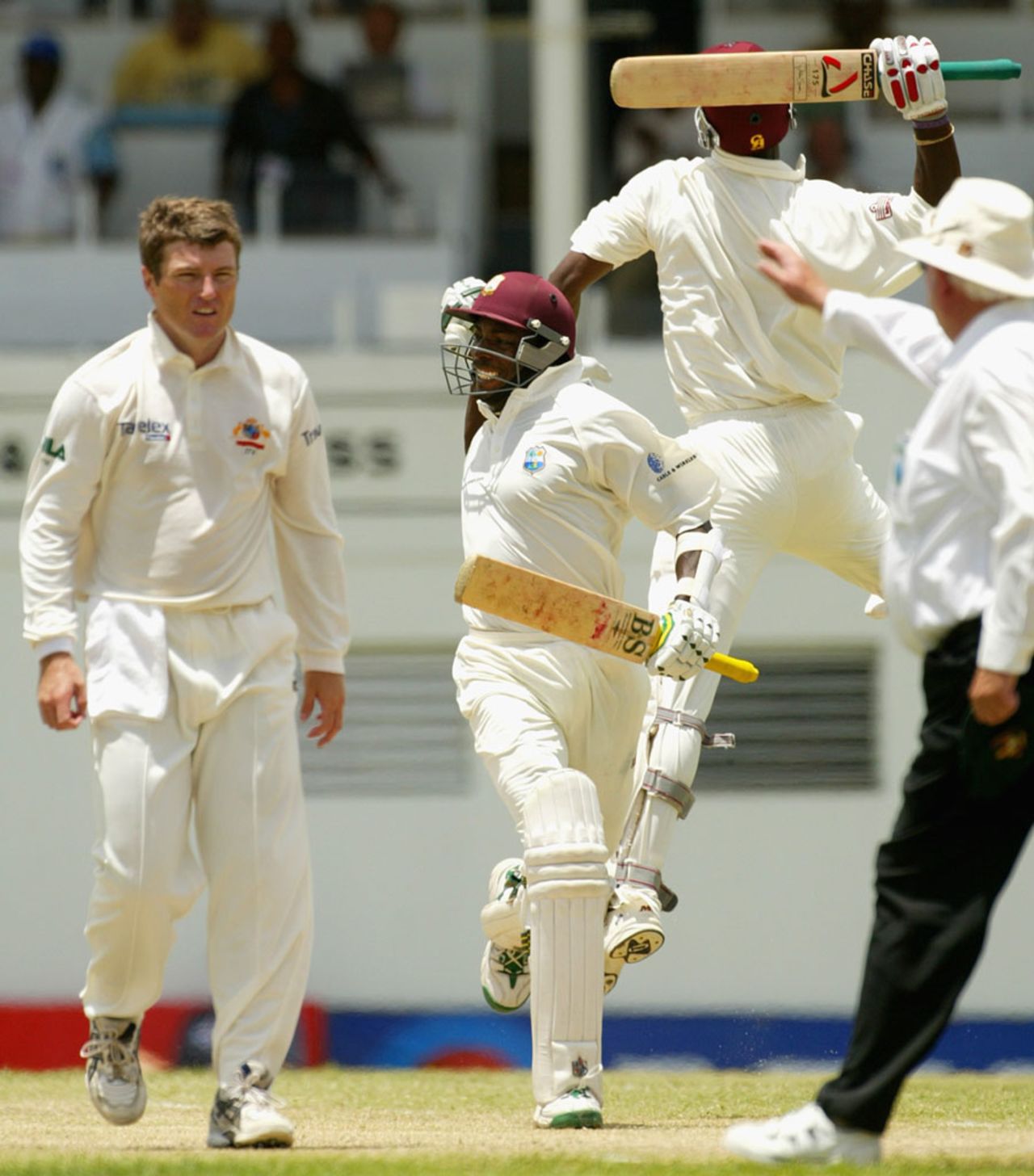 Vasbert Drakes and Omari Banks celebrate the win, West Indies v Australia, 4th Test, St John's, Antigua, 5th day, May 13, 2003
