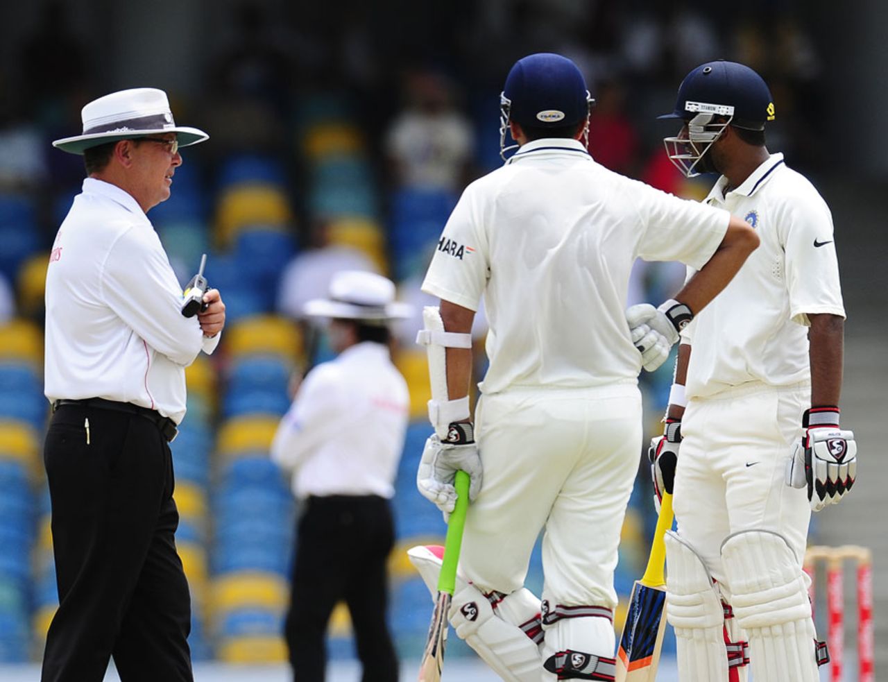 Umpire Ian Gould speaks with the batsmen before deciding to overturn the appeal for catch against Rahul Dravid, West Indies v India, 2nd Test, Bridgetown, 4th day, July 1, 2011 
