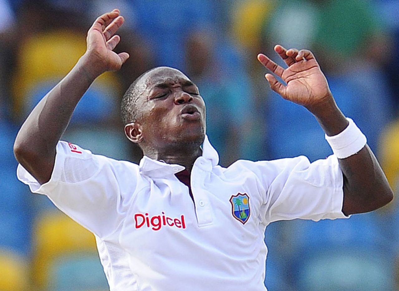 Fidel Edwards reacts after the batsman has a close shave, West Indies v India, 2nd Test, Bridgetown, 4th day, July 1, 2011