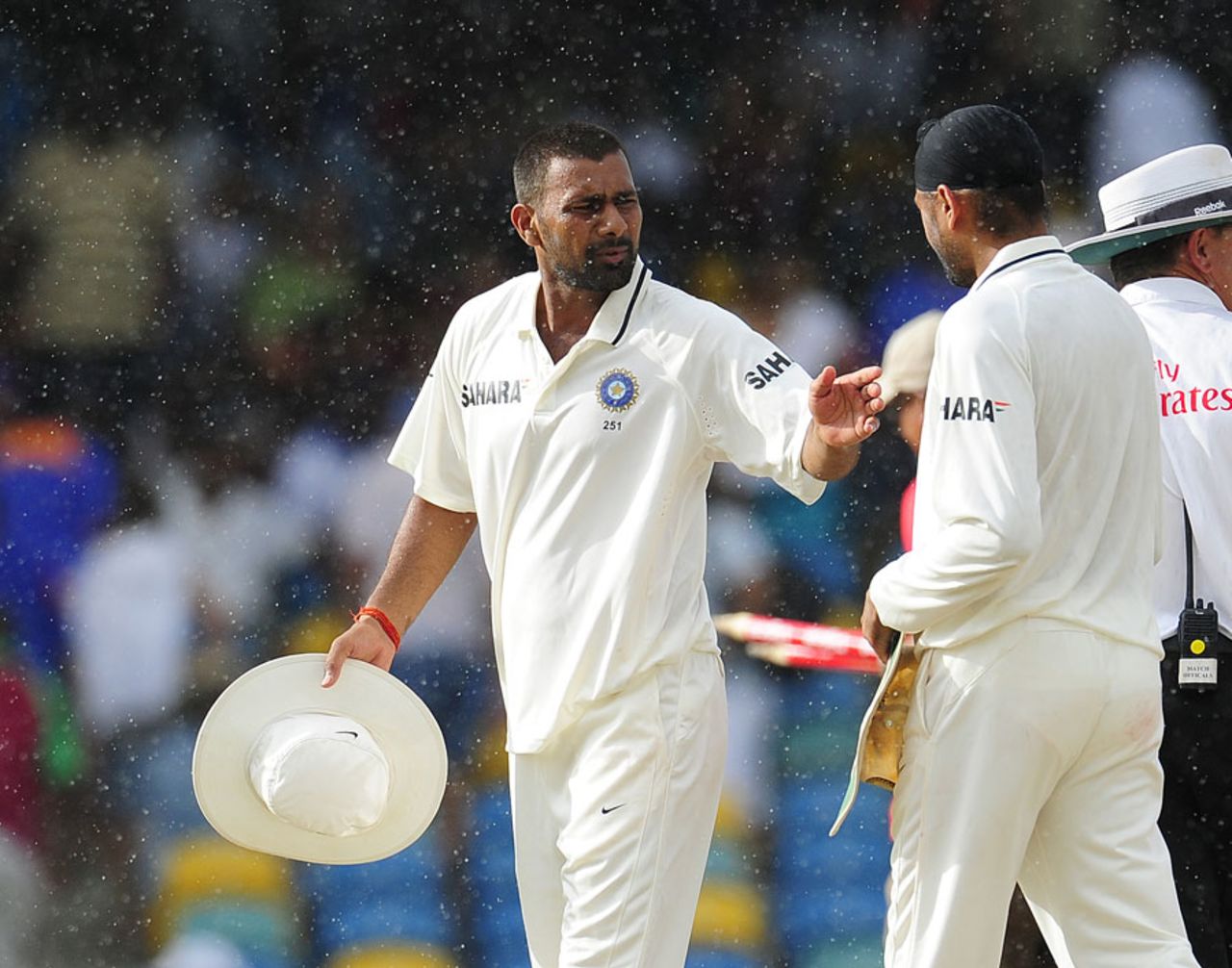 Praveen Kumar and Harbhajan Singh walk off as rain stops play, West Indies v India, 2nd Test, Bridgetown, 5th day, July 2, 2011 
