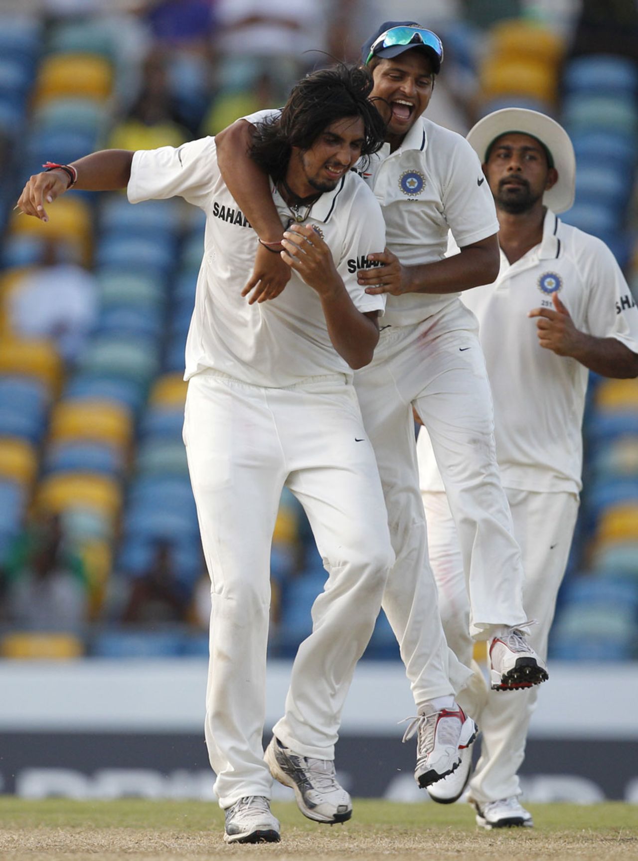 Ishant Sharma is mobbed by team-mates on picking up his tenth wicket for the match, West Indies v India, 2nd Test, Bridgetown, 5th day, July 2, 2011 